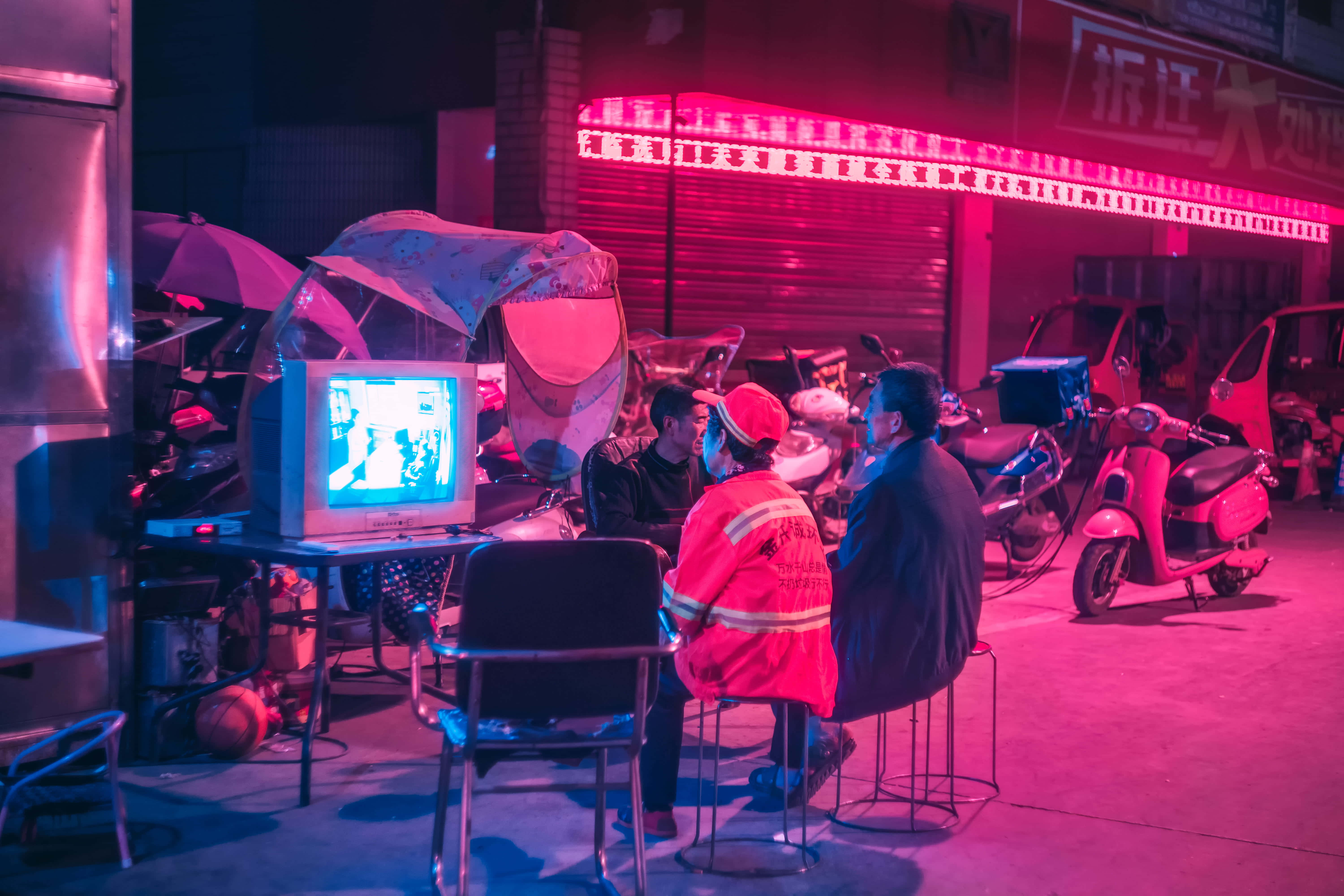 CRT TV, neon-drenched alley, blue glow, 5K Desktop Wallpaper