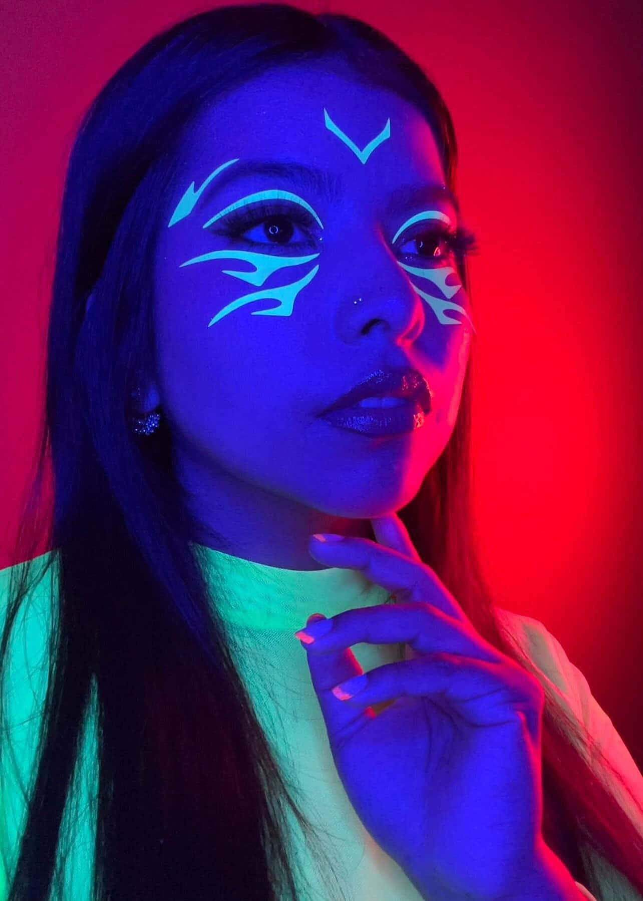 glowing blue tribal face paint, vivid red and blue neon-lit background, woman, HD Phone Wallpaper
