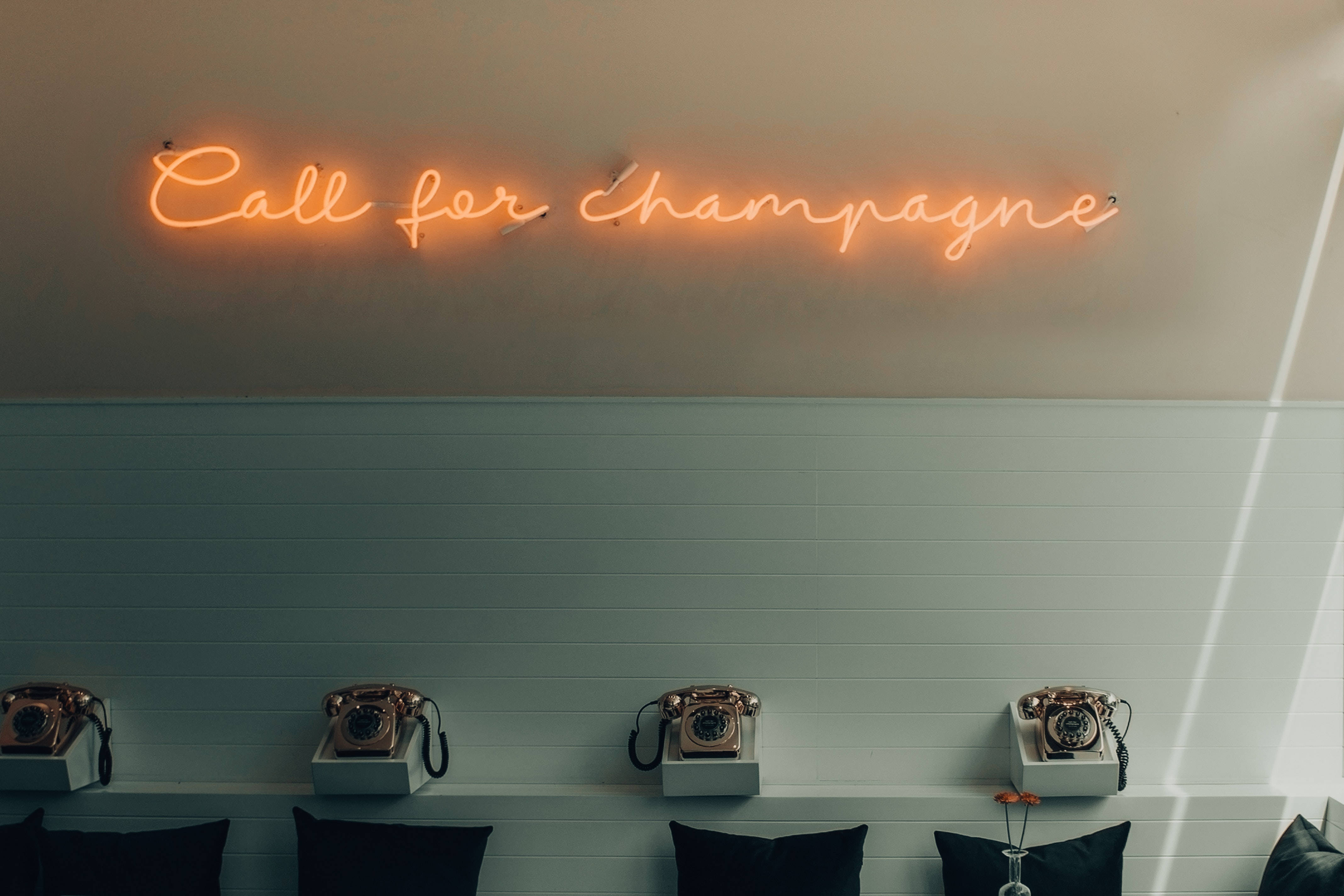 call for champagne, warm orange neon sign, vintage rotary phones, 4K Desktop Wallpaper
