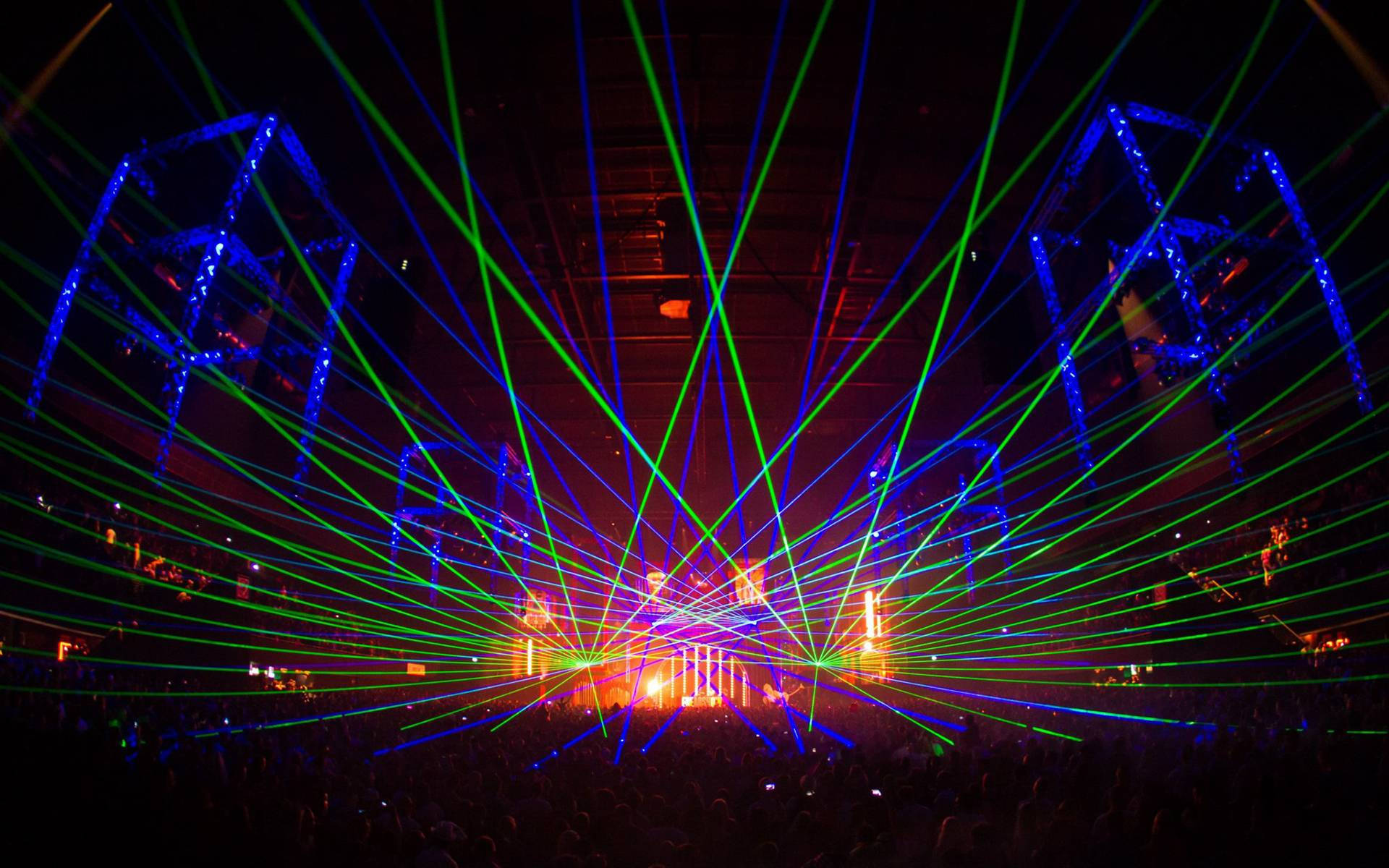 vibrant green and blue laser beams, dark concert hall, sea of silhouetted crowd members, Full HD Desktop Wallpaper