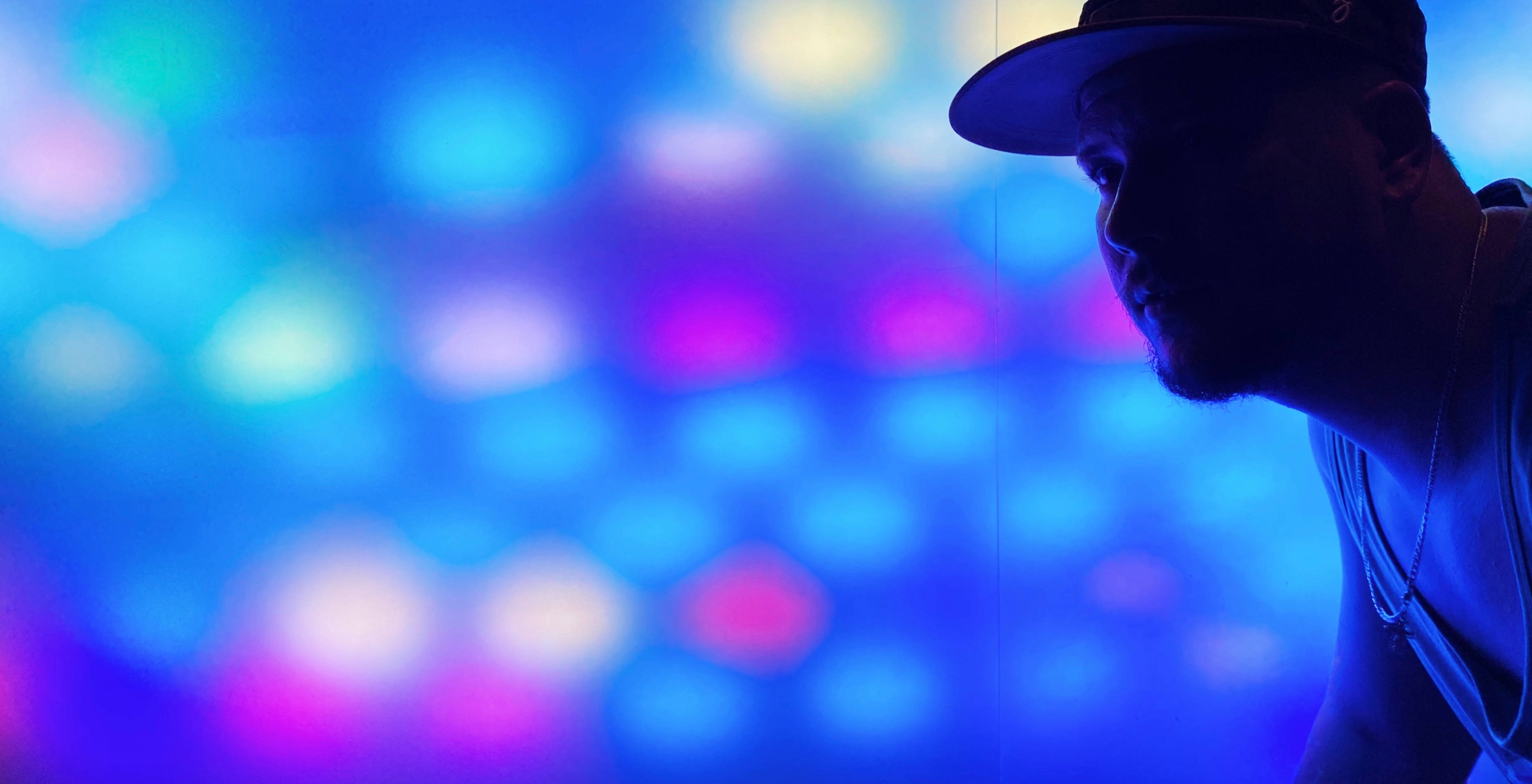 Neon Purple iPhone, man in silhouette, cap, 2K Desktop Wallpaper