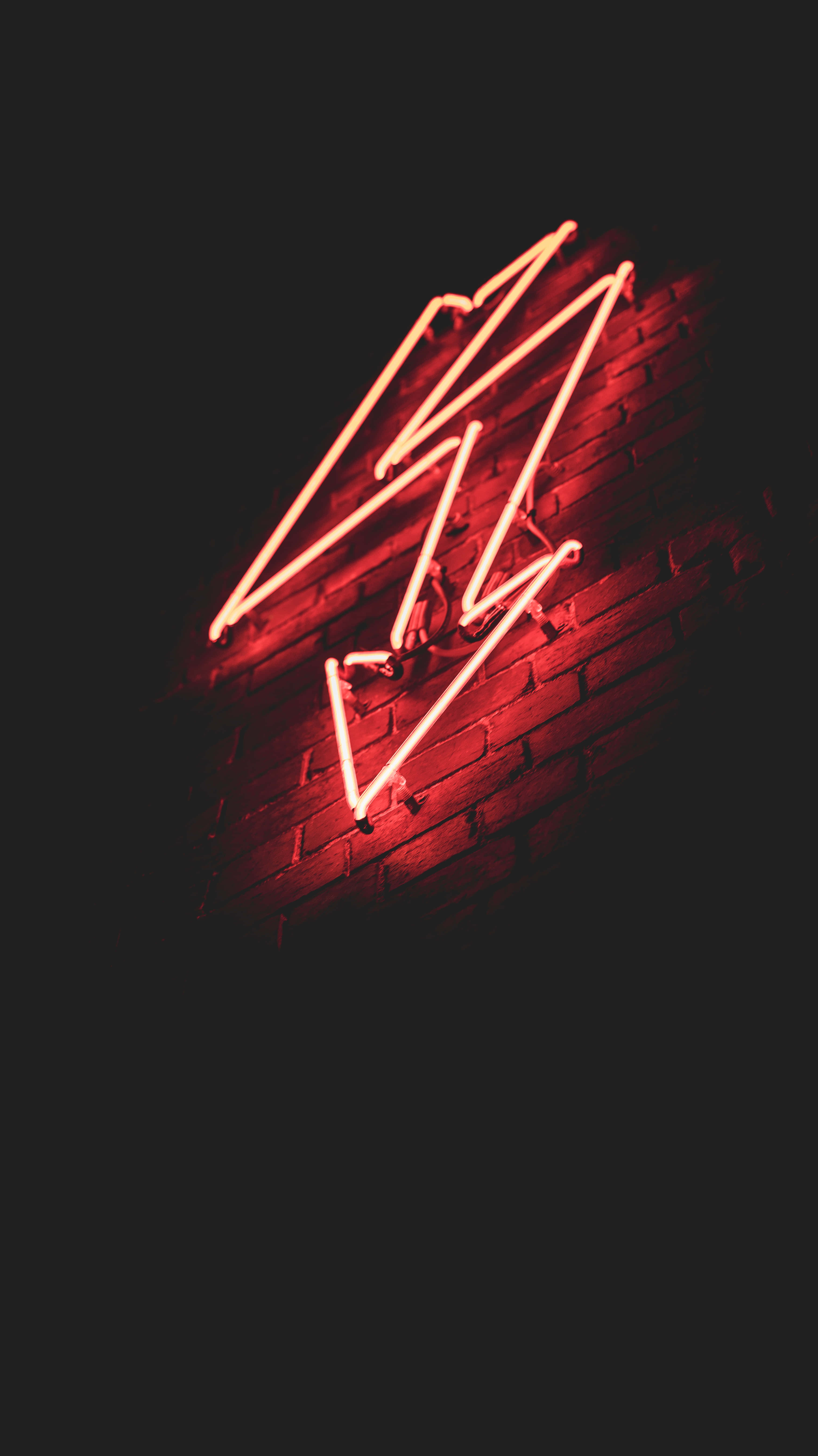 Neon Red Aesthetic, glowing red neon lightning bolt sign, dark brick wall, 5K Phone Wallpaper