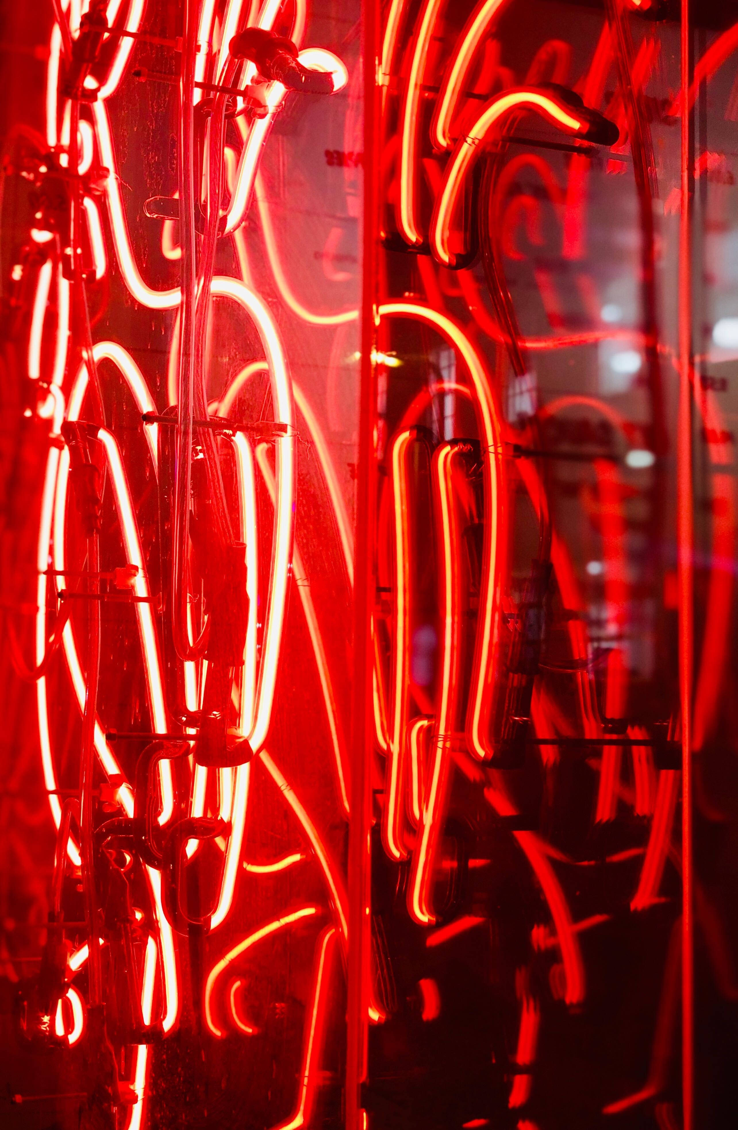 red neon tubes, intricate patterns, dark reflective surface, 4K Phone Wallpaper