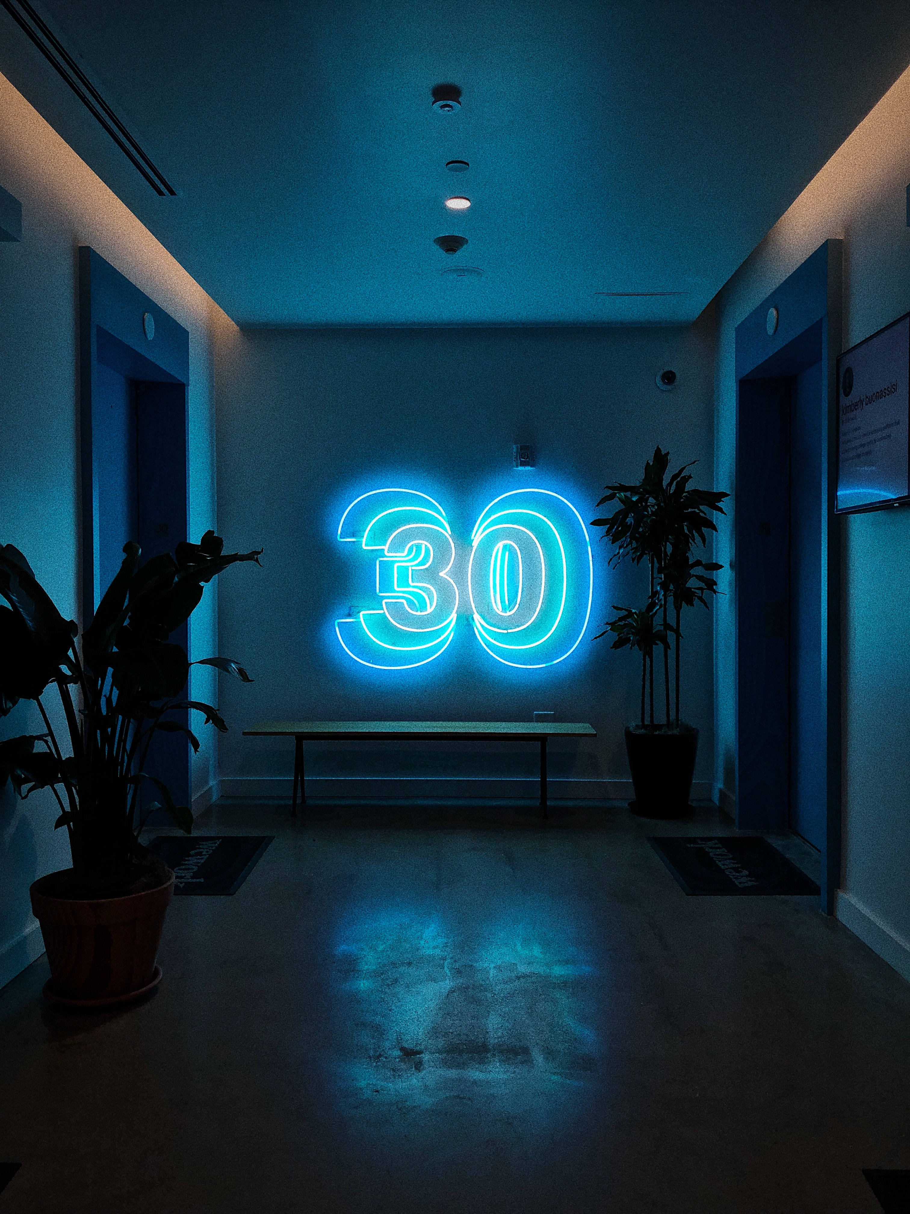 Psychedelic 30 Neon Sign, glowing blue neon number 30, minimalist hallway, 4K Phone Wallpaper