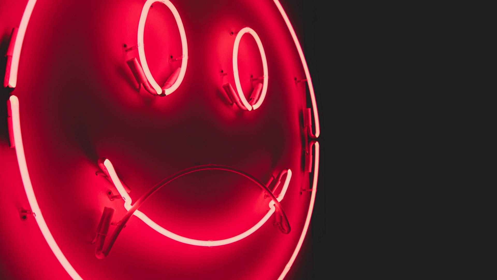 Neon Smile, glowing red neon smiley face, sad downturned mouth, Full HD Desktop Wallpaper