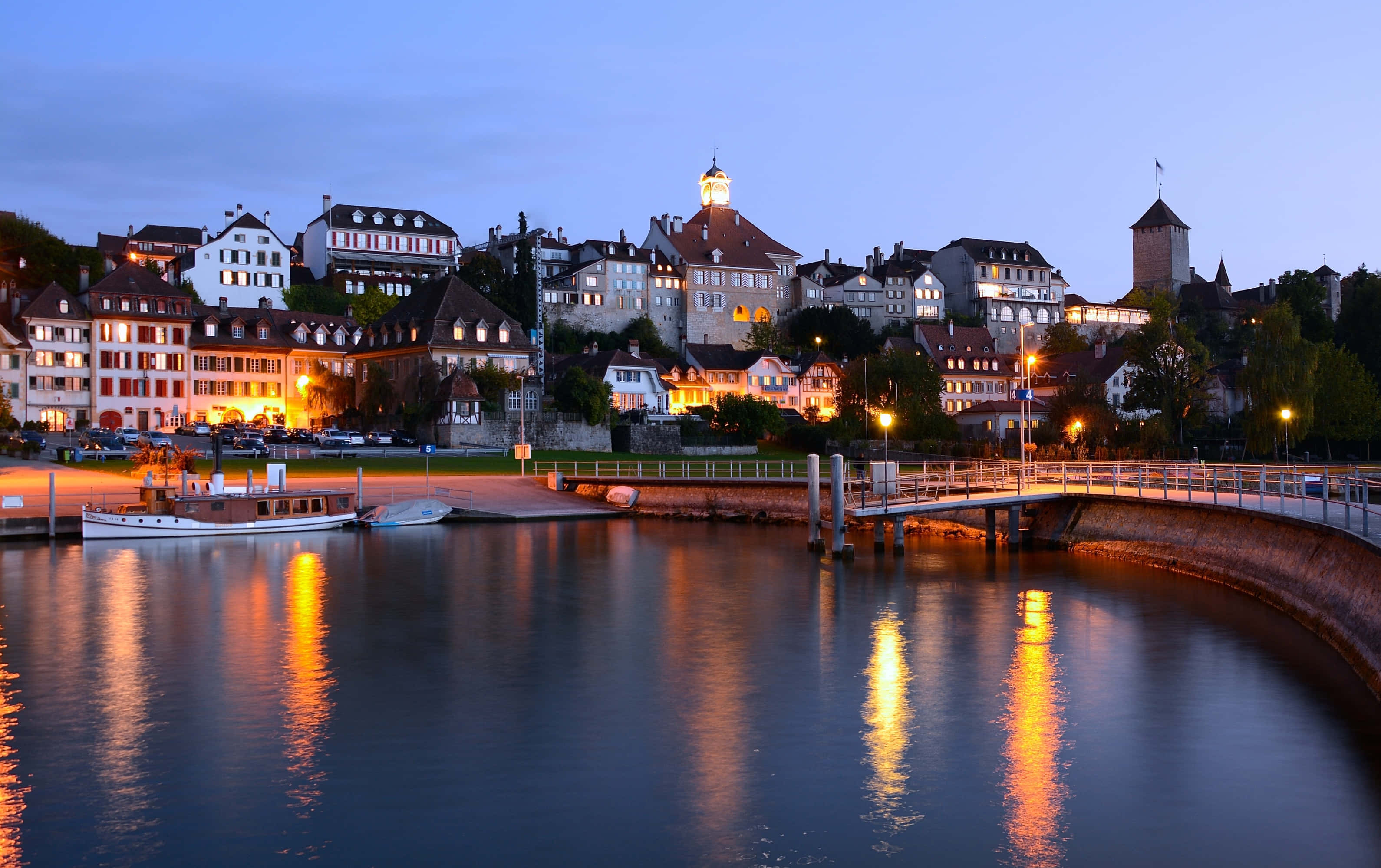 Neuchâtel, lakeside twilight view, warm lights, 2K Desktop Wallpaper