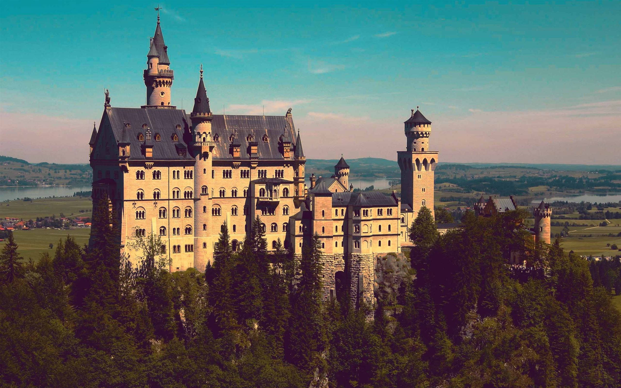 Neuschwanstein Castle, sunlight, clear blue sky, 2K Desktop Wallpaper