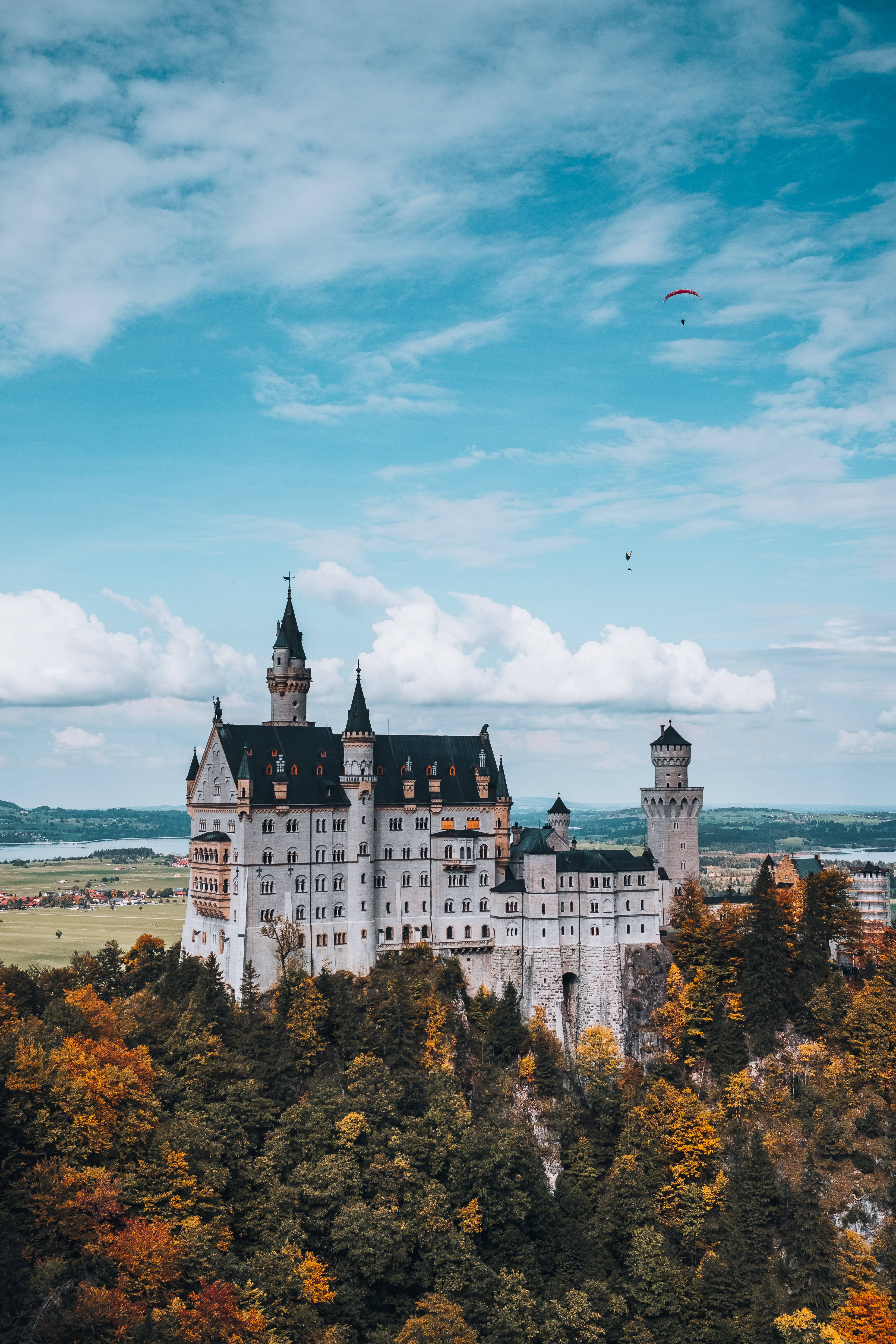 Neuschwanstein Castle, orange and green leaves, white castle, 5K Phone Wallpaper
