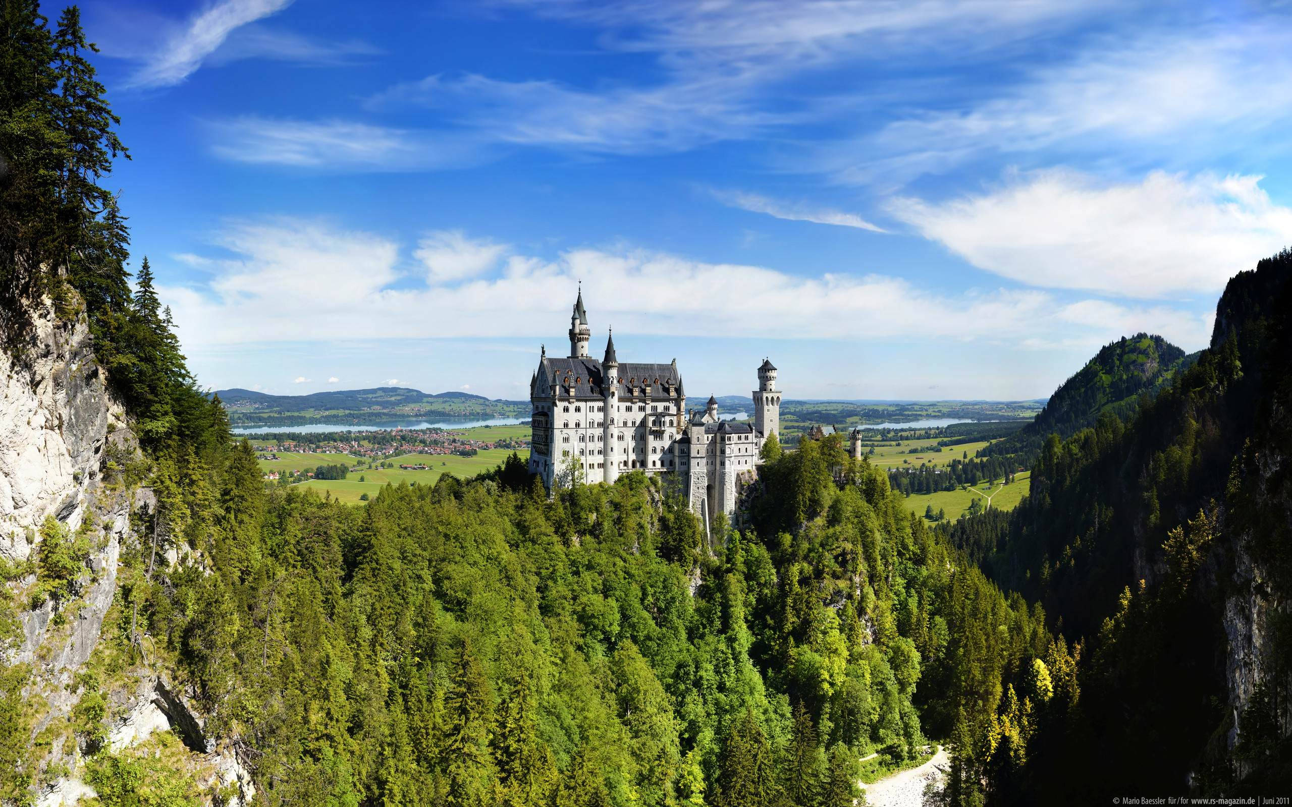 Neuschwanstein Castle, green trees, distant, 2K Desktop Wallpaper