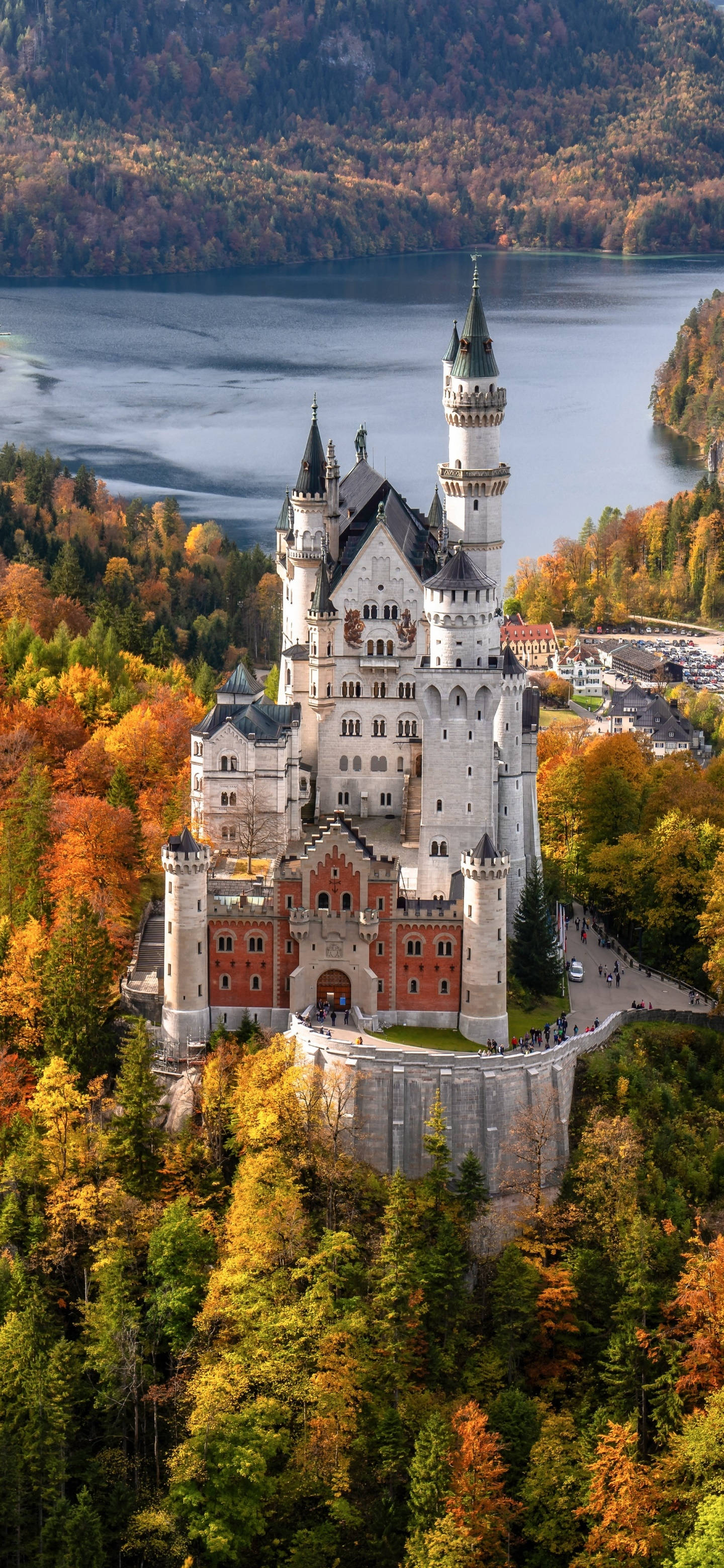 Neuschwanstein Castle, autumn forests, serene lake, 2K Phone Wallpaper