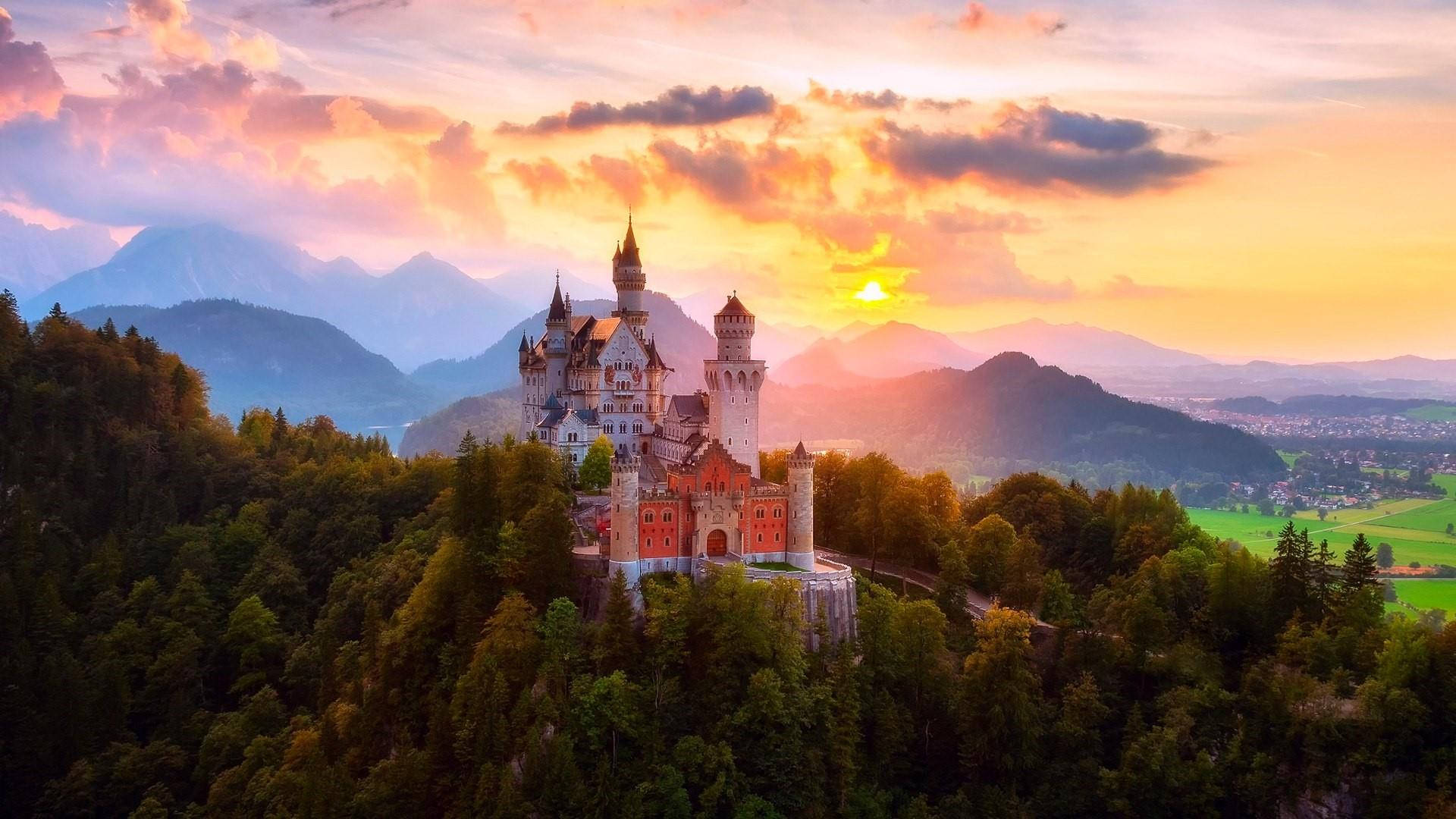 Neuschwanstein Castle, golden sunset light, forested hill, Full HD Desktop Wallpaper