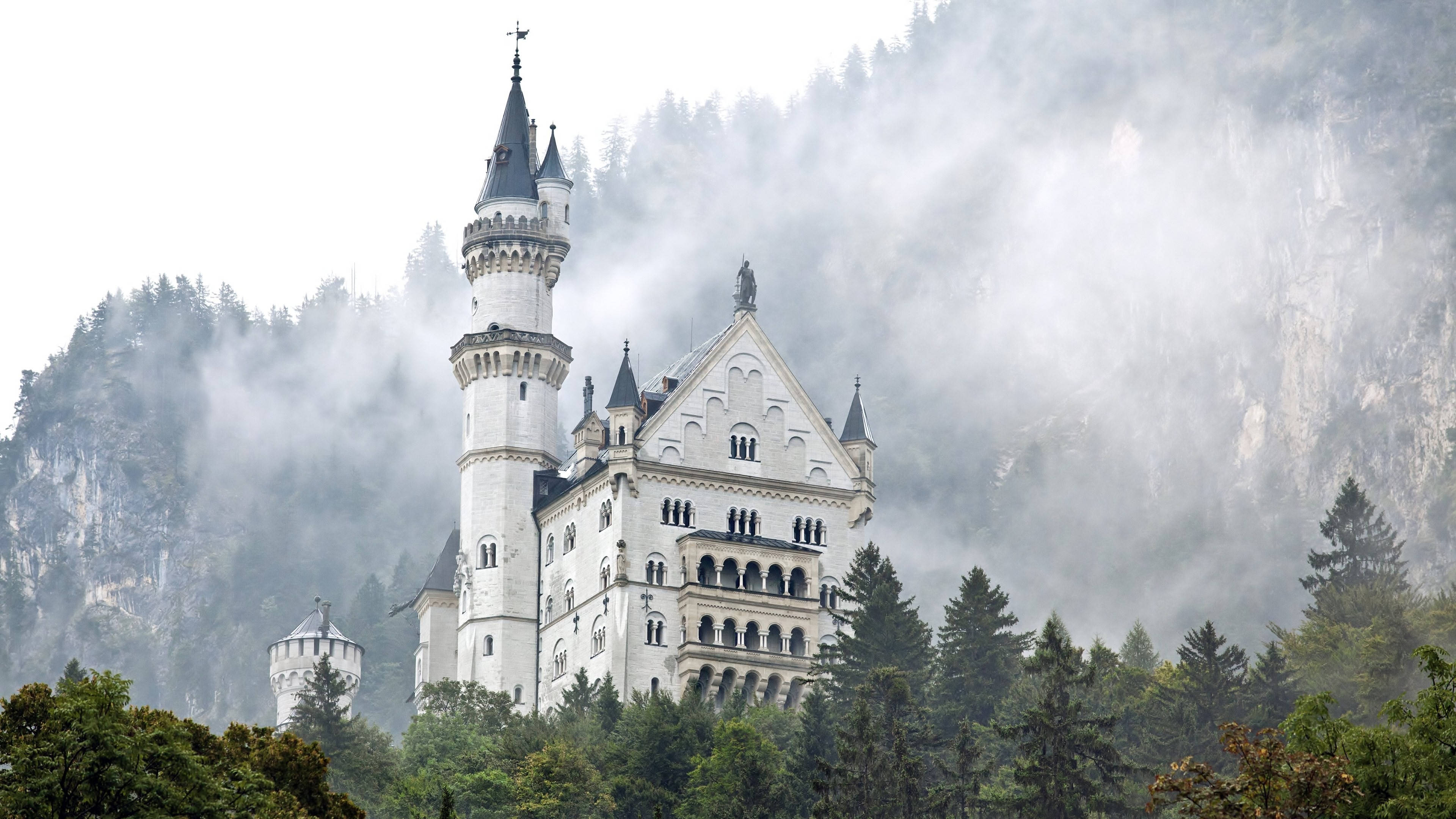Neuschwanstein Castle, fog, misty forested hillside, 4K Desktop Wallpaper