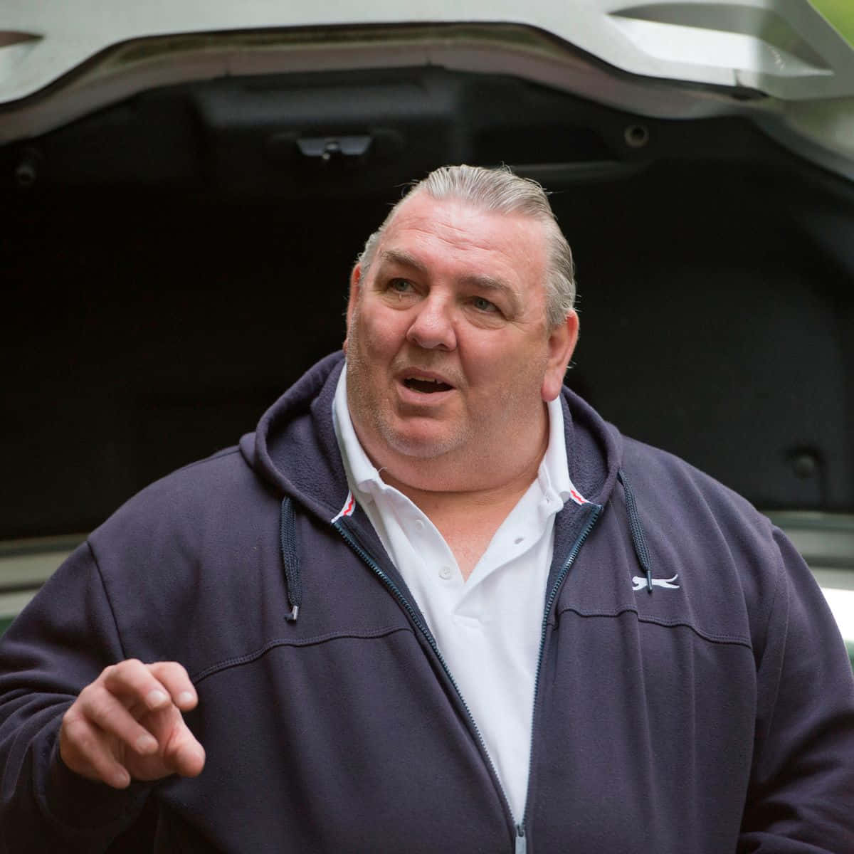 Neville Southall, dark hoodie, open car trunk, SD Desktop Wallpaper