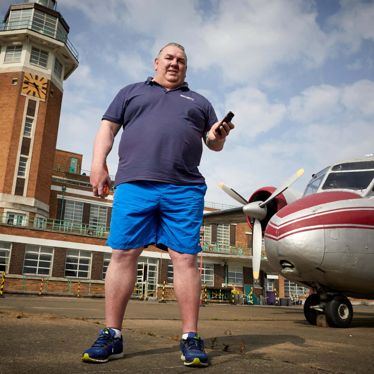 Neville Southall, blue shorts, vintage red and silver propeller plane, SD Desktop Wallpaper