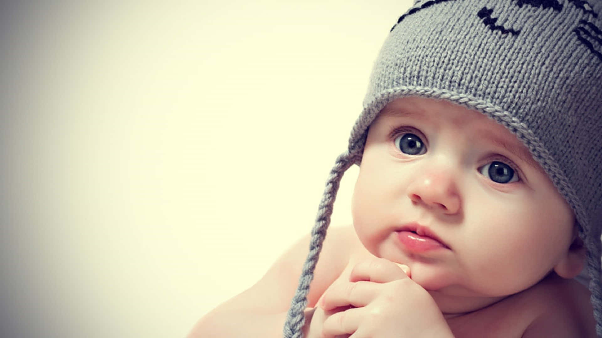 gray knitted hat, ear flaps, smiley face pattern, Full HD Desktop Wallpaper