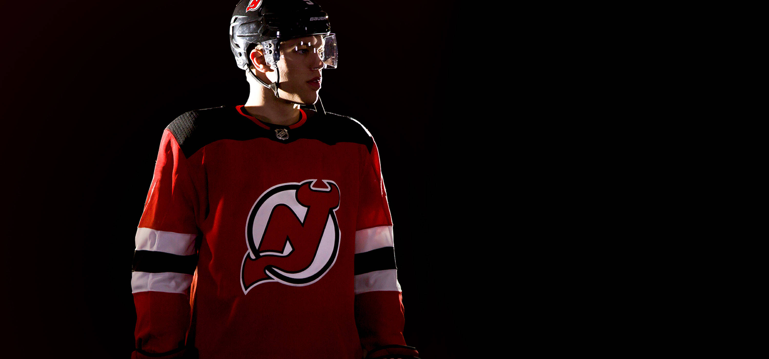 New Jersey Devils, red New Jersey Devils jersey, dramatic studio lighting, 2K Desktop Wallpaper