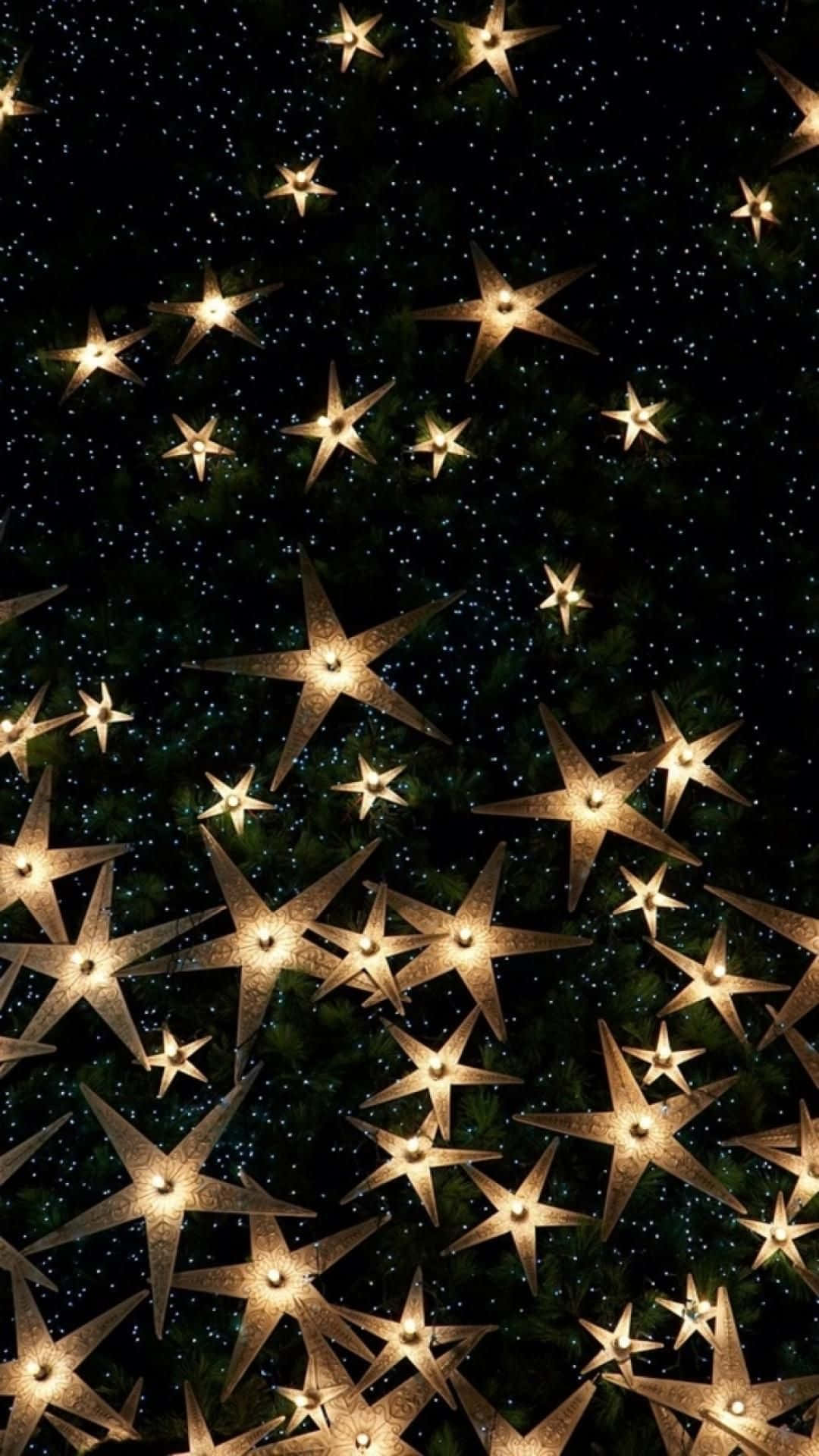 New Year iPhone, golden star-shaped lights, dark green pine tree, Full HD Phone Wallpaper