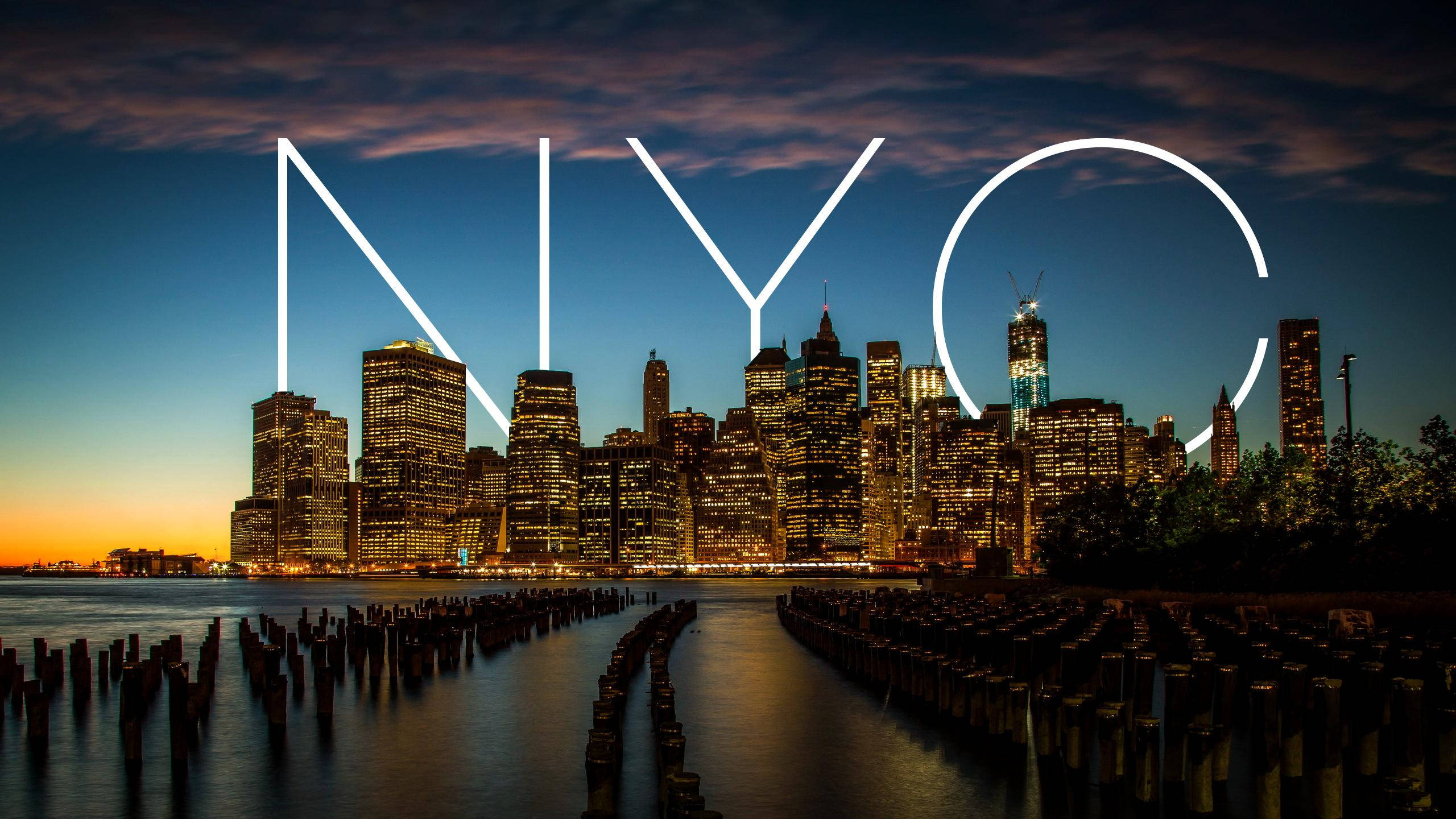 New York City, twilight, glowing 'NYC' letters, 2K Desktop Wallpaper