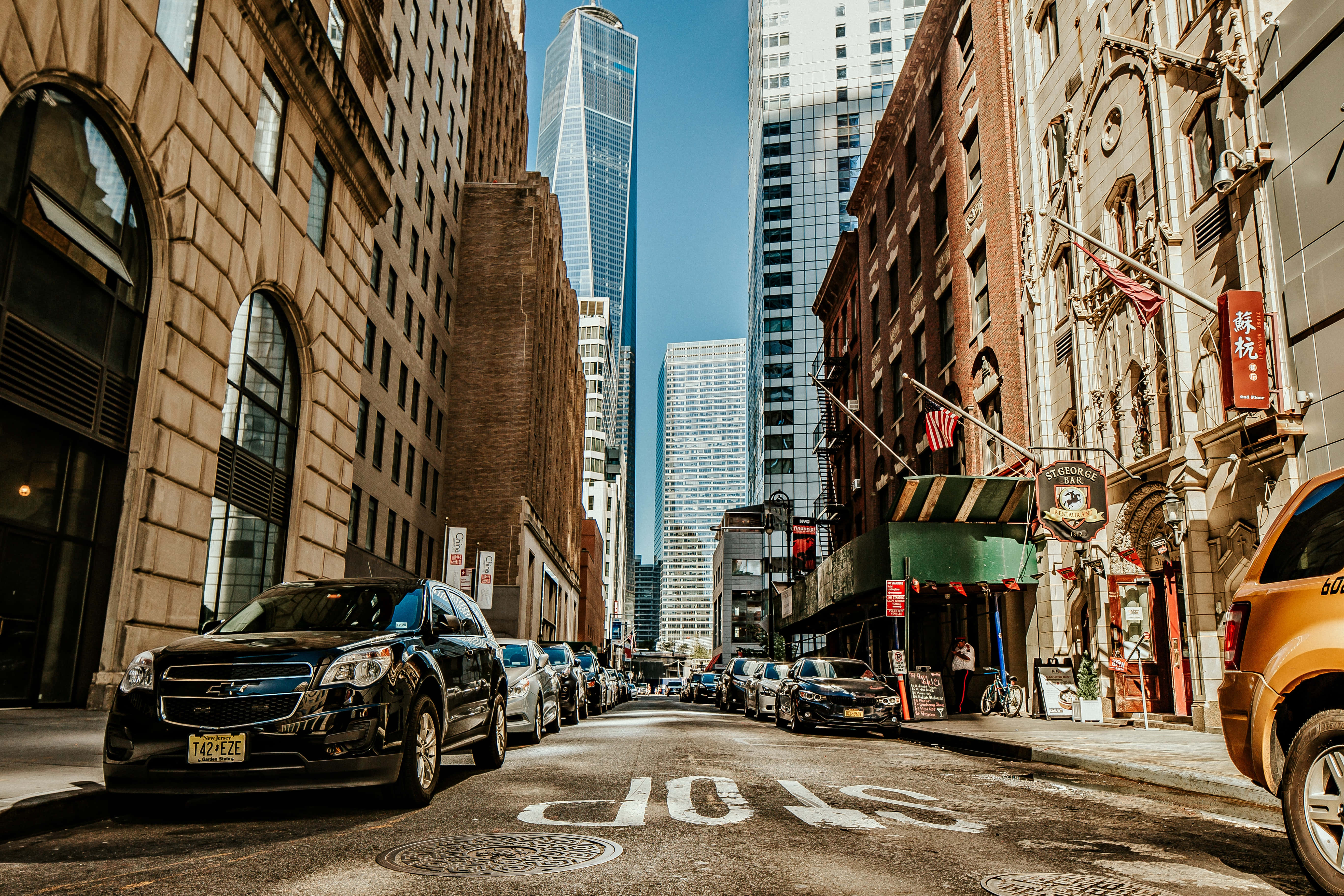 New York City, sunlit urban street, historic brick buildings, 5K Desktop Wallpaper