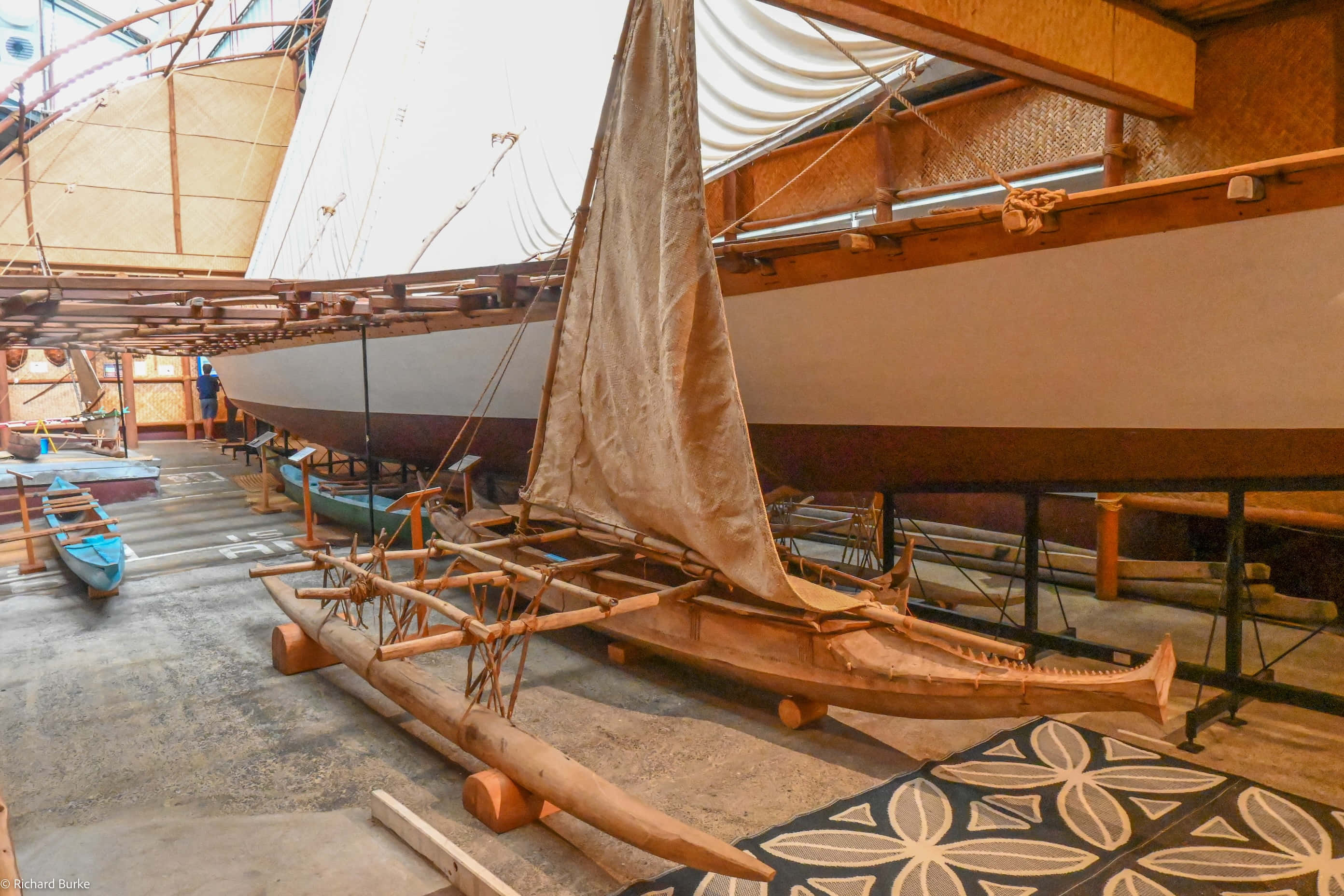 New Zealand Maritime Museum, traditional wooden outrigger canoe, tan sail, 2K Desktop Wallpaper