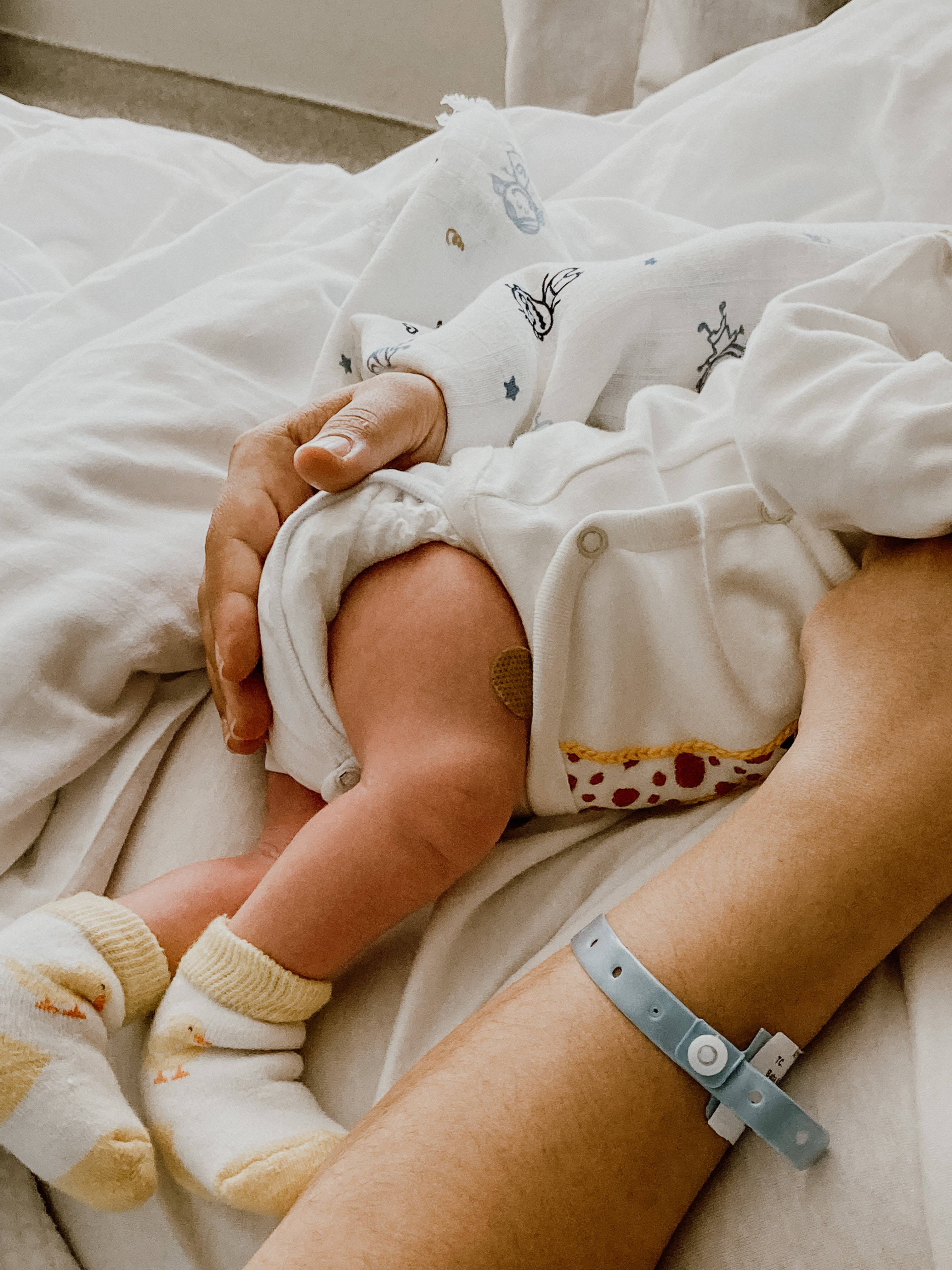 newborn baby girl, white onesie, yellow socks, 4K Phone Wallpaper
