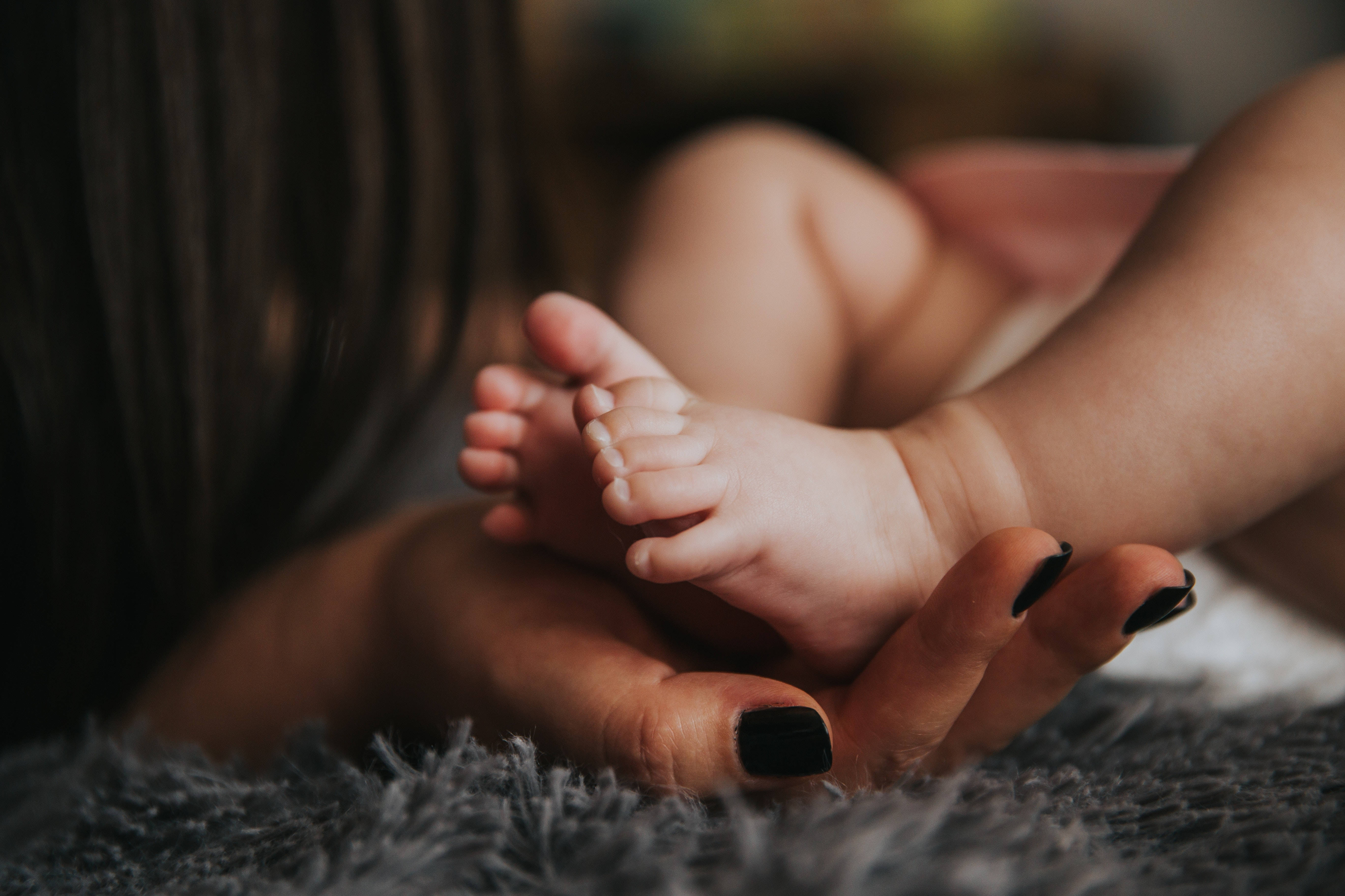 Newborn Baby Girl, black nails, adult's hands, 5K Desktop Wallpaper