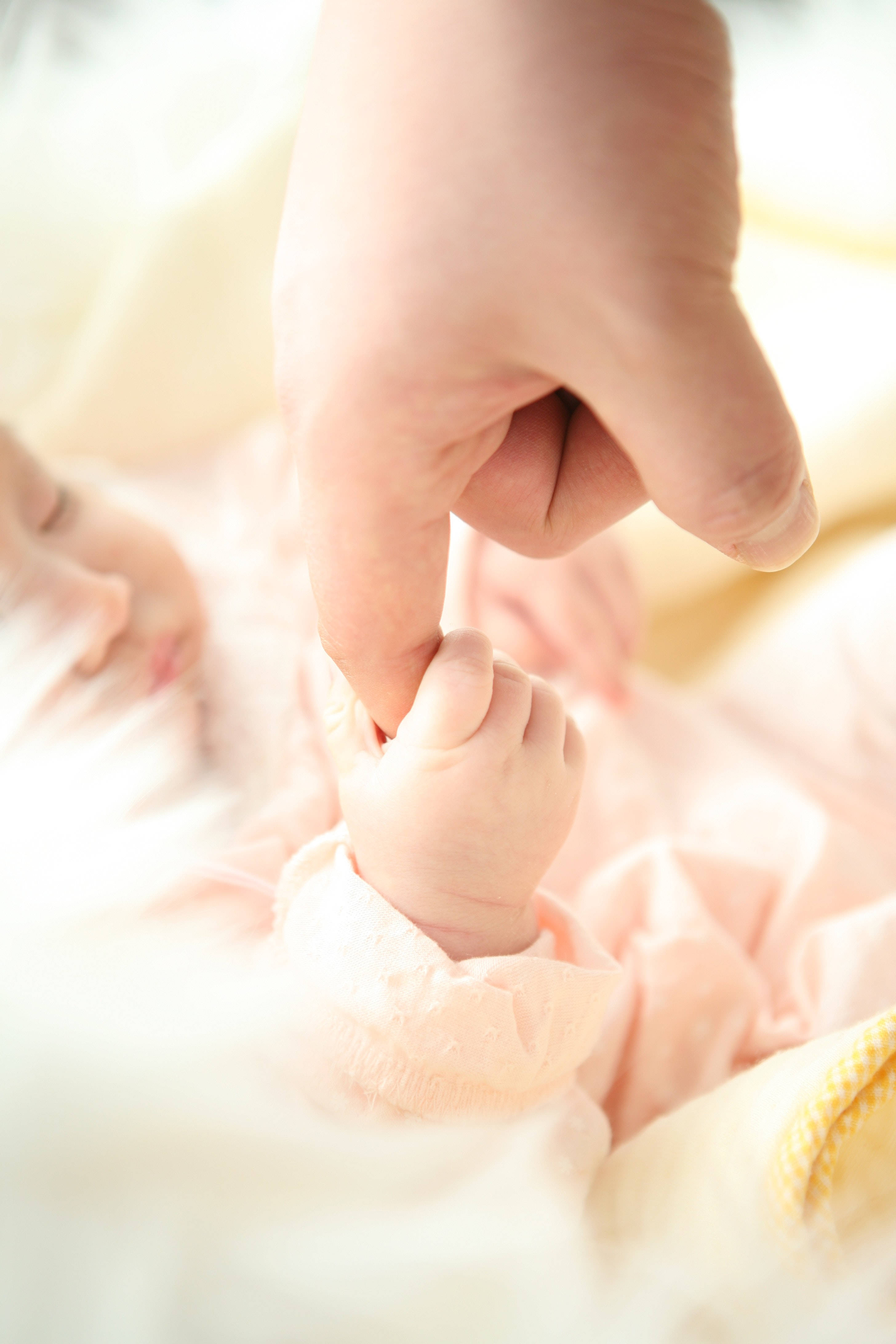 Newborn Baby Girl, yellow, tender close-up, 4K Phone Wallpaper
