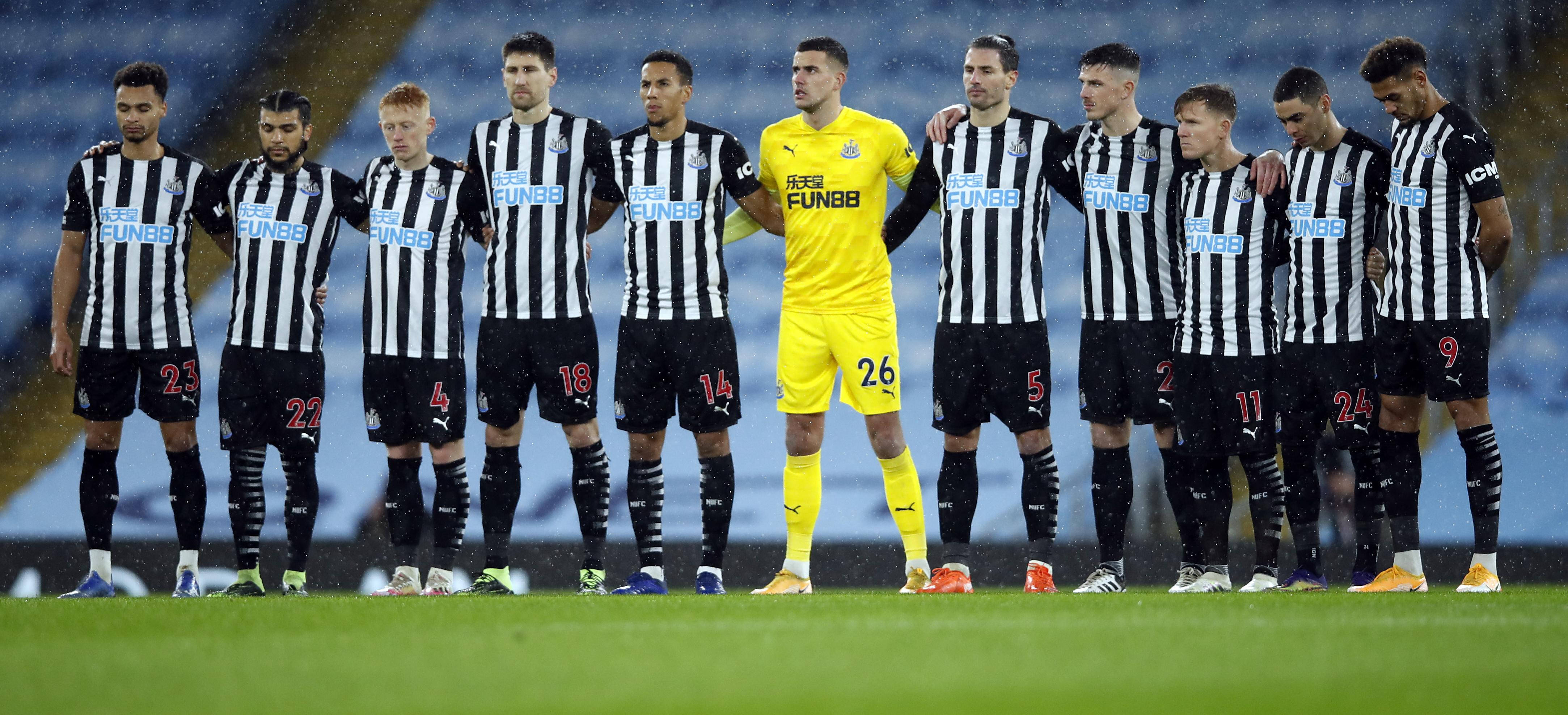 Newcastle United FC, black and white striped jerseys, rain-slicked pitch, 4K Desktop Wallpaper