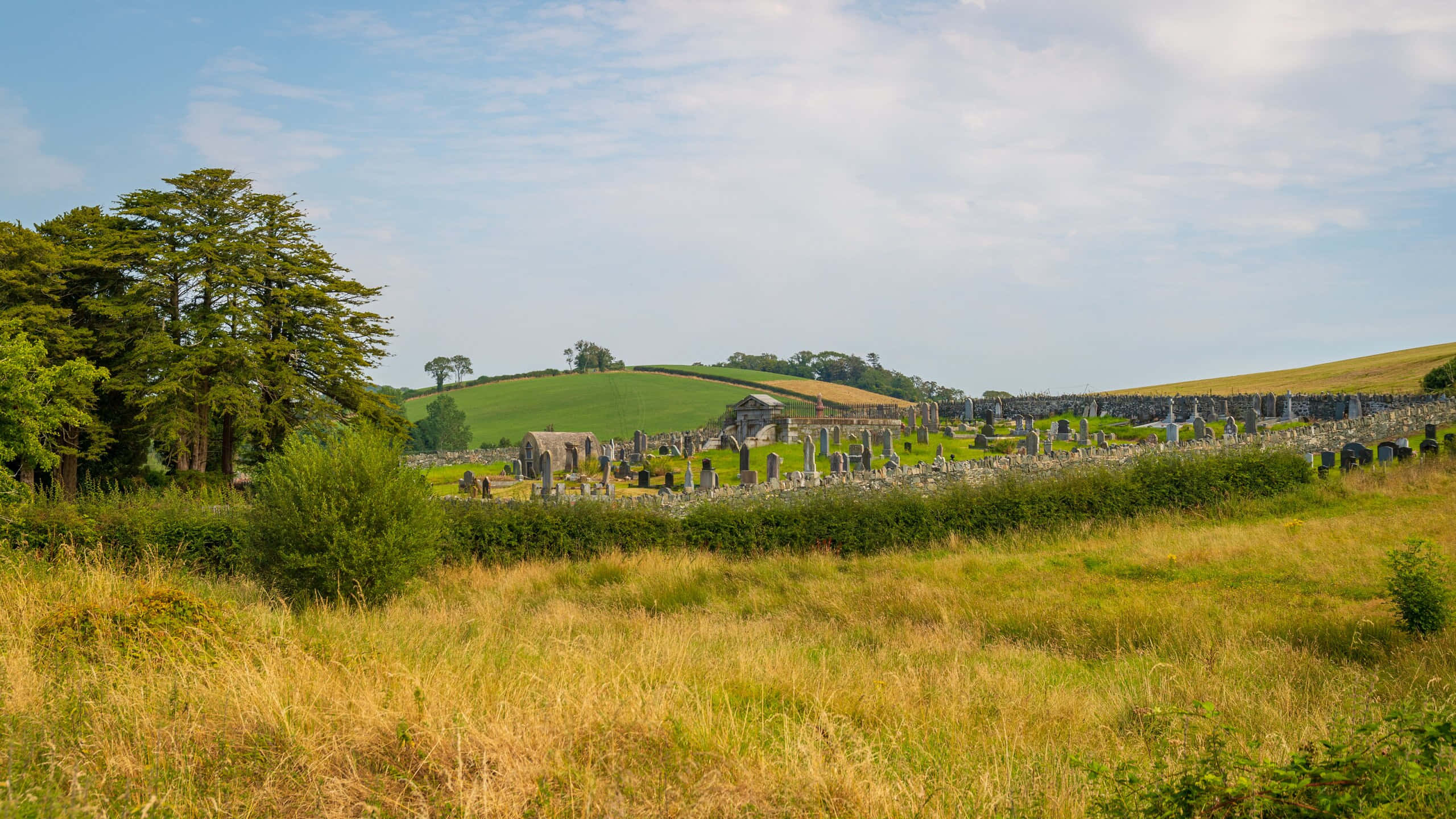 Newry, countryside graveyard, weathered gravestones, 2K Desktop Wallpaper