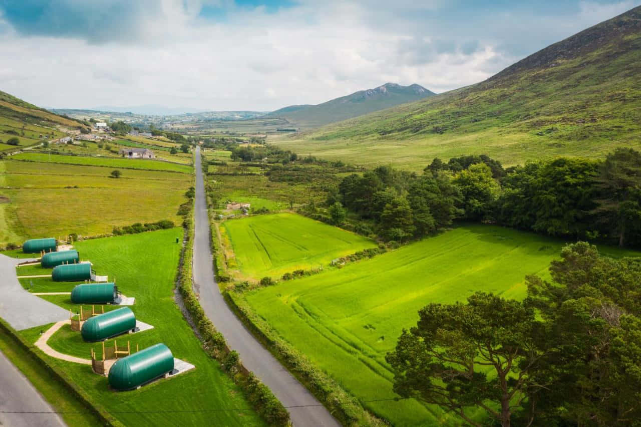 Newry, green capsule cabins, winding road, HD Desktop Wallpaper