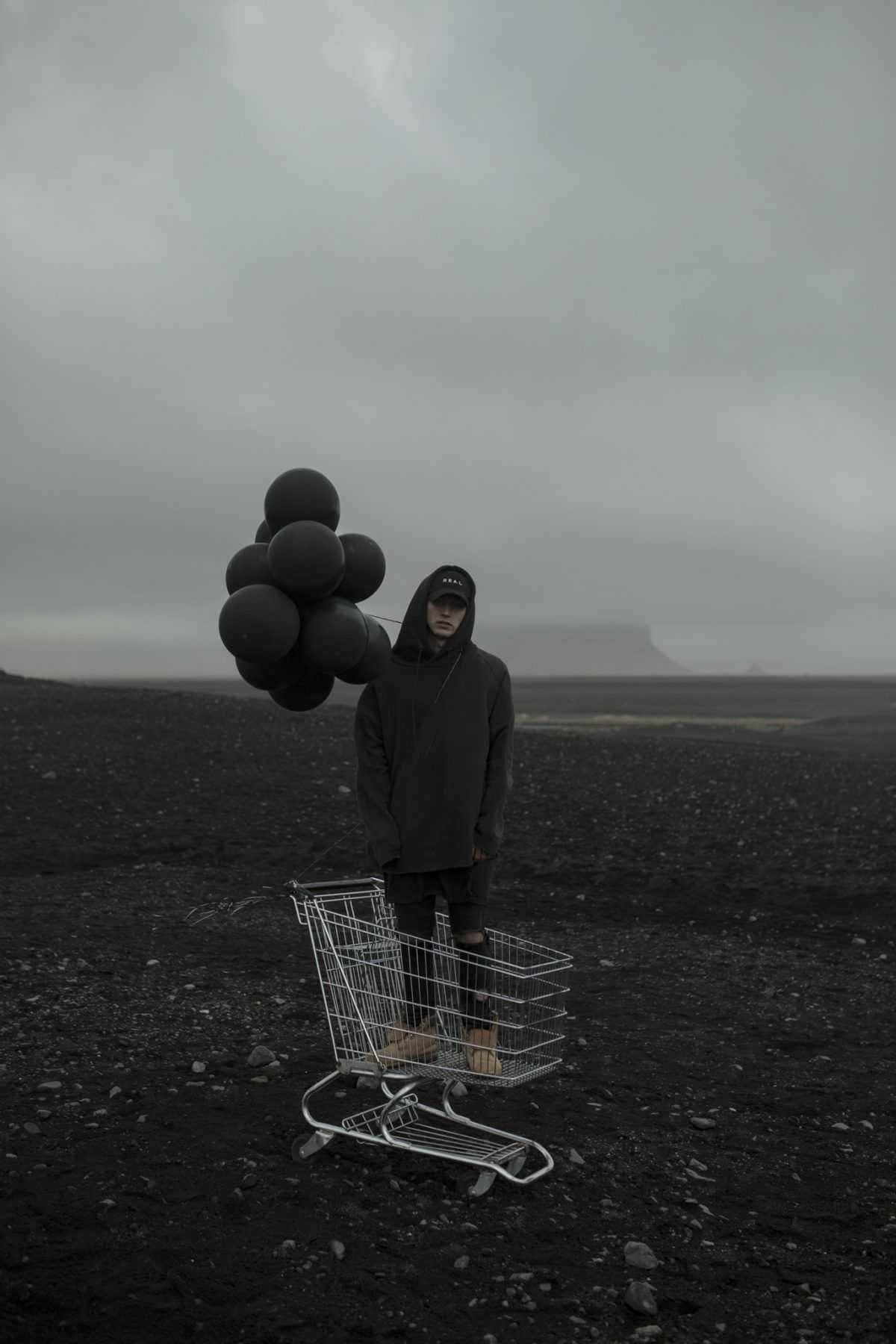 NF, hooded figure, black lava field, HD Phone Wallpaper