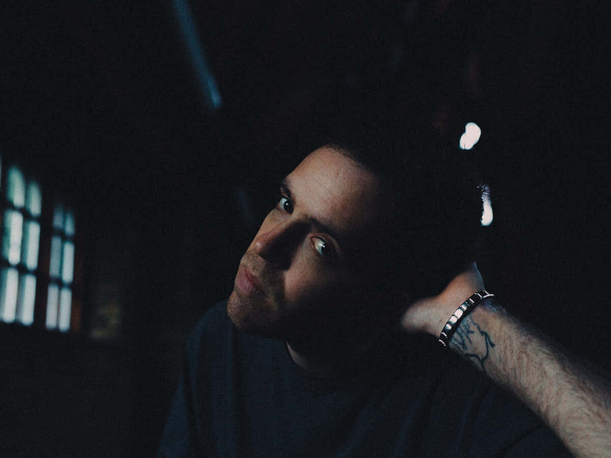 NF, tattooed arm, shadowed room, SD Desktop Wallpaper