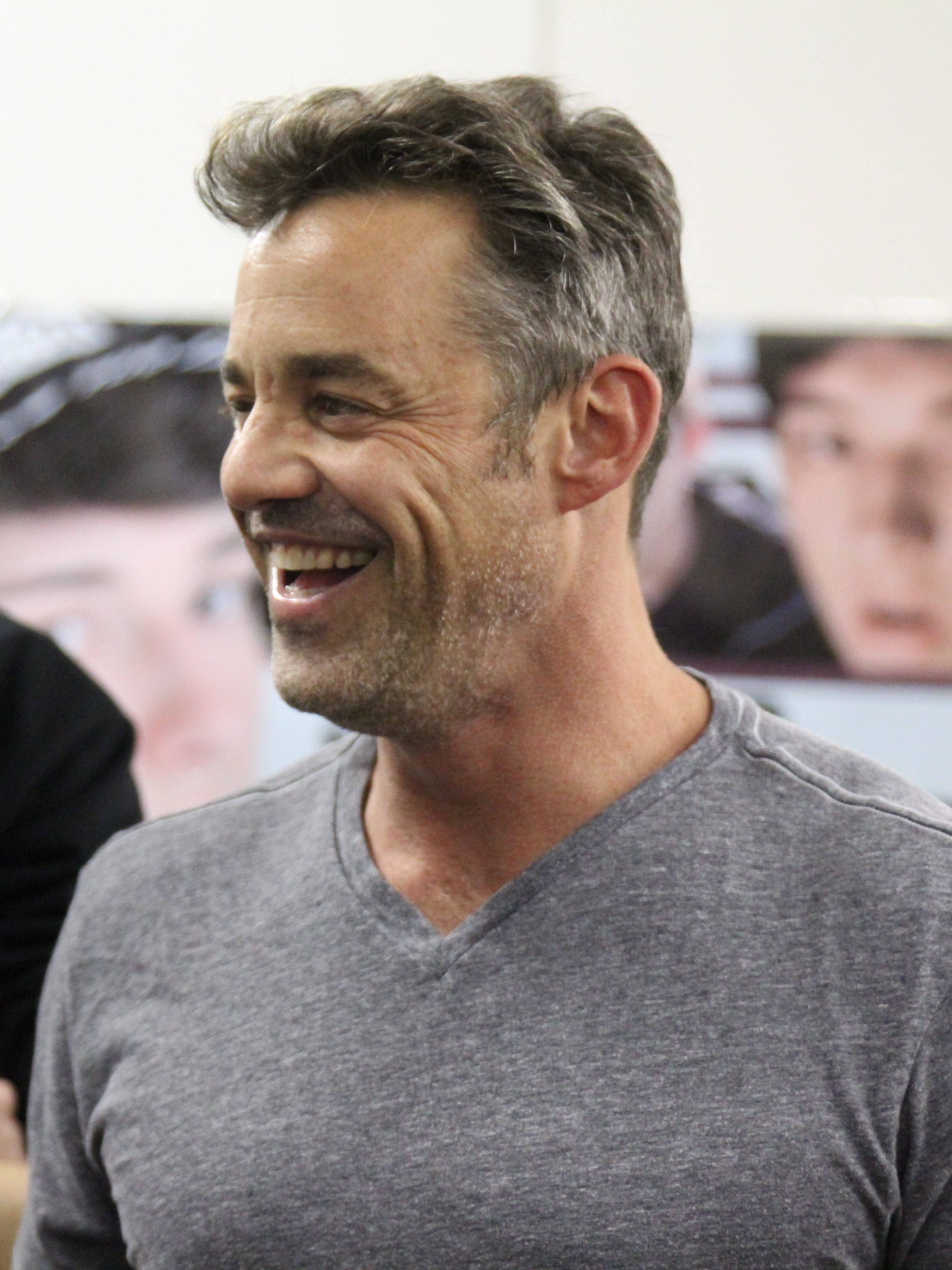 Nicholas Brendon, gray v-neck shirt, brightly lit indoor setting, 2K Phone Wallpaper