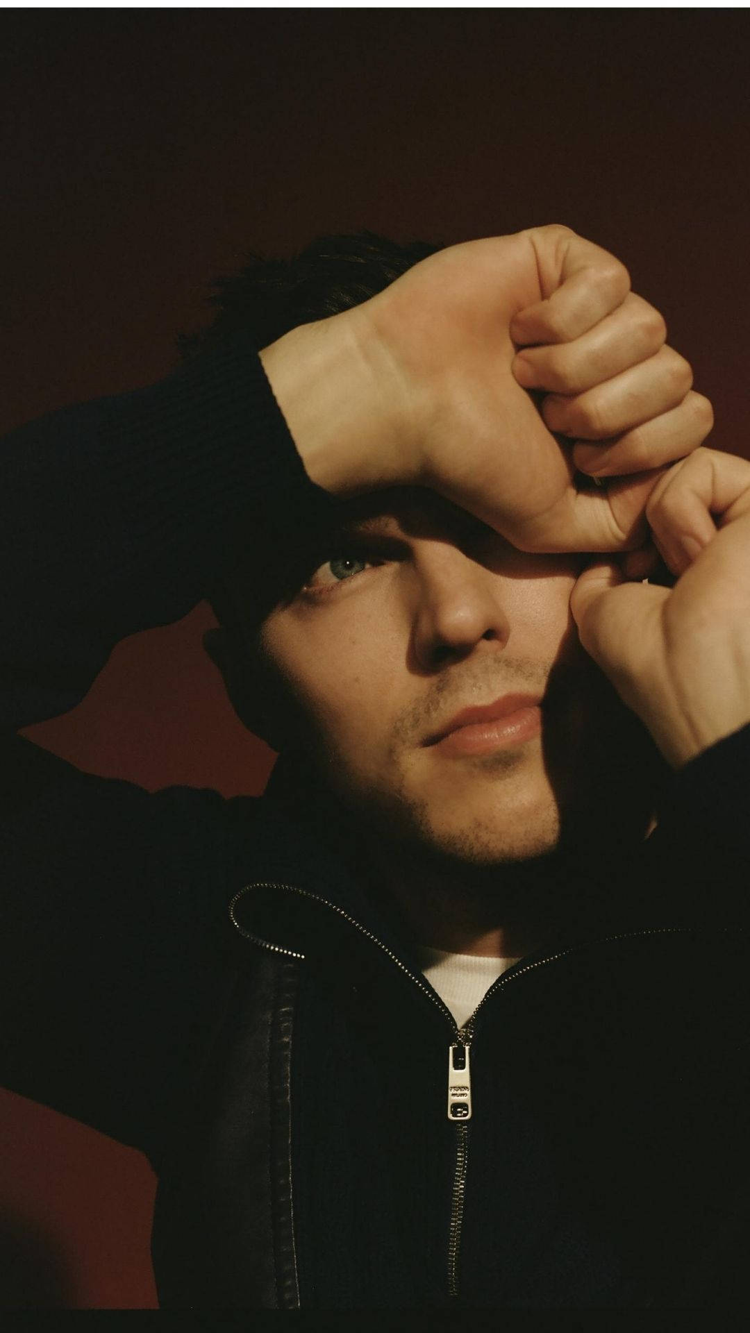 Nicholas Hoult, black zip-up jacket, dark red background, Full HD Phone Wallpaper