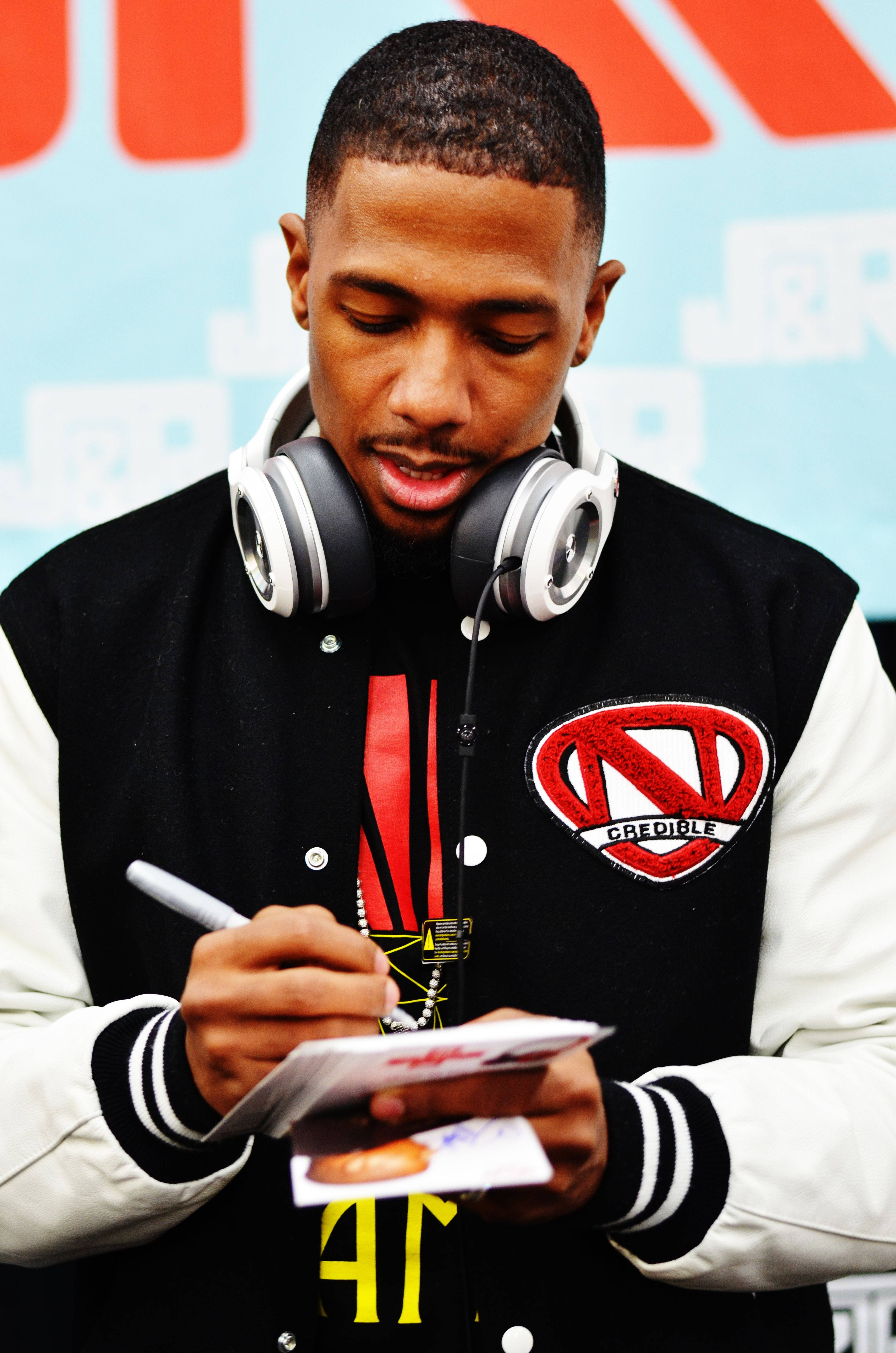 Nick Cannon, black and white varsity jacket, red logo, 4K Phone Wallpaper