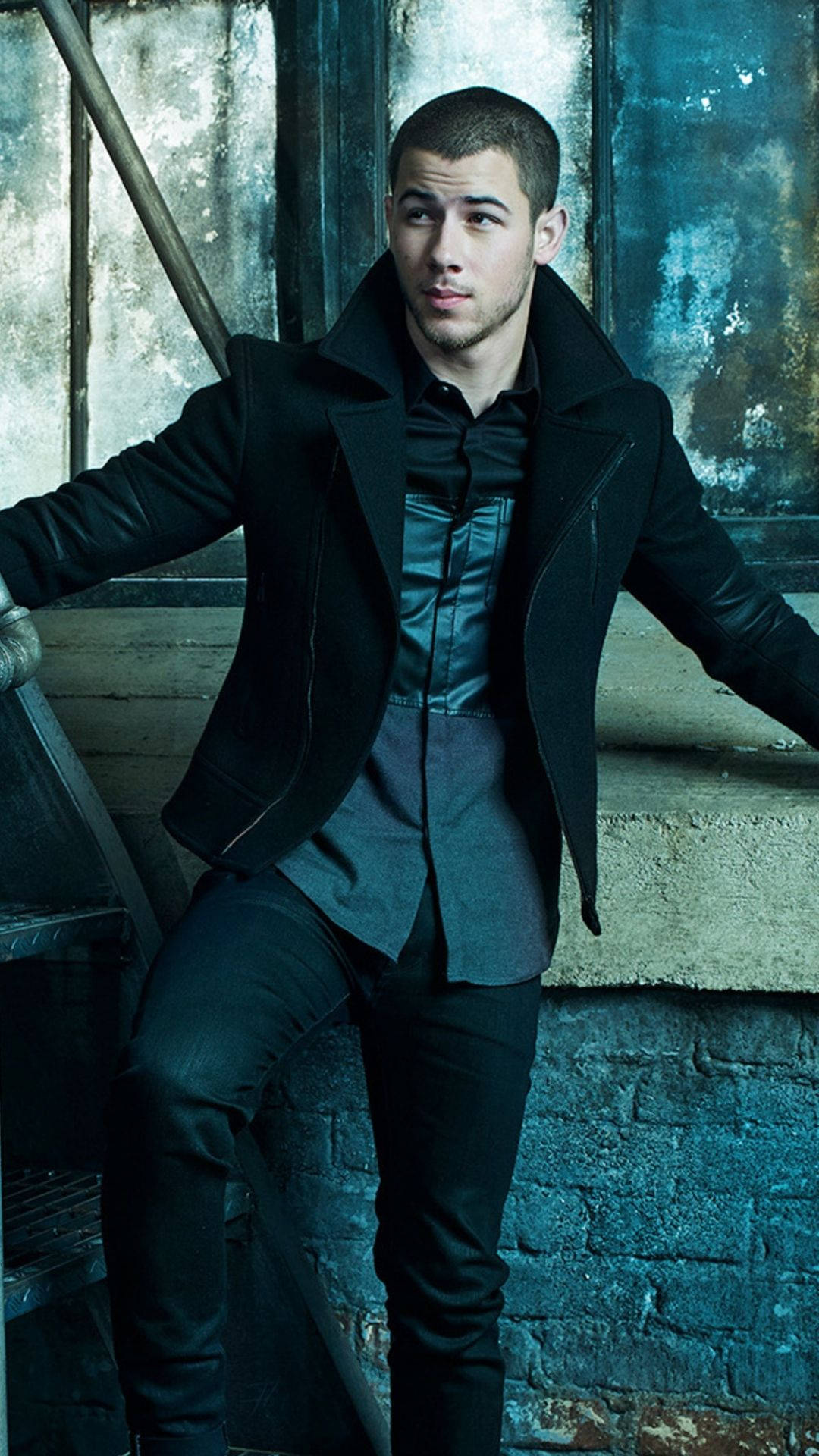 Nick Jonas, black coat, weathered brick wall, Full HD Phone Wallpaper