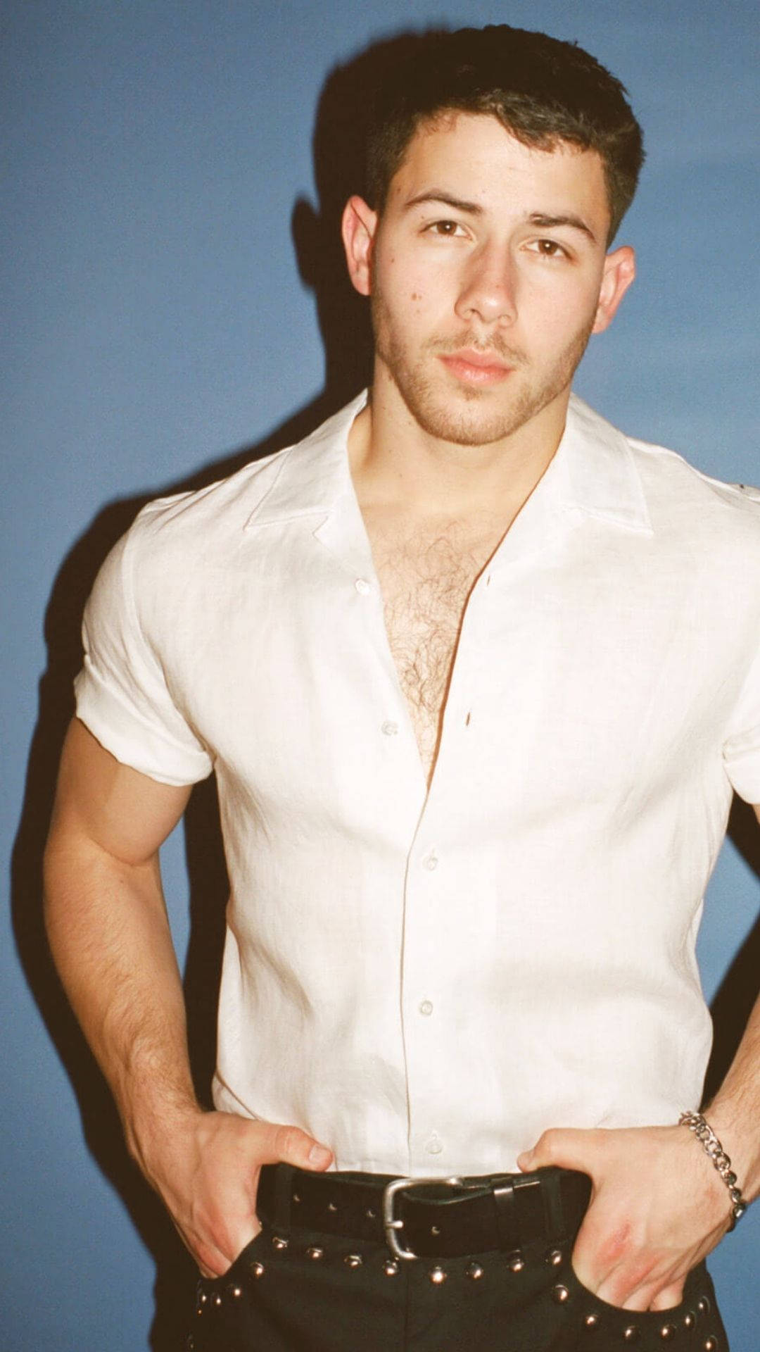 Nick Jonas, white shirt, solid blue background, Full HD Phone Wallpaper