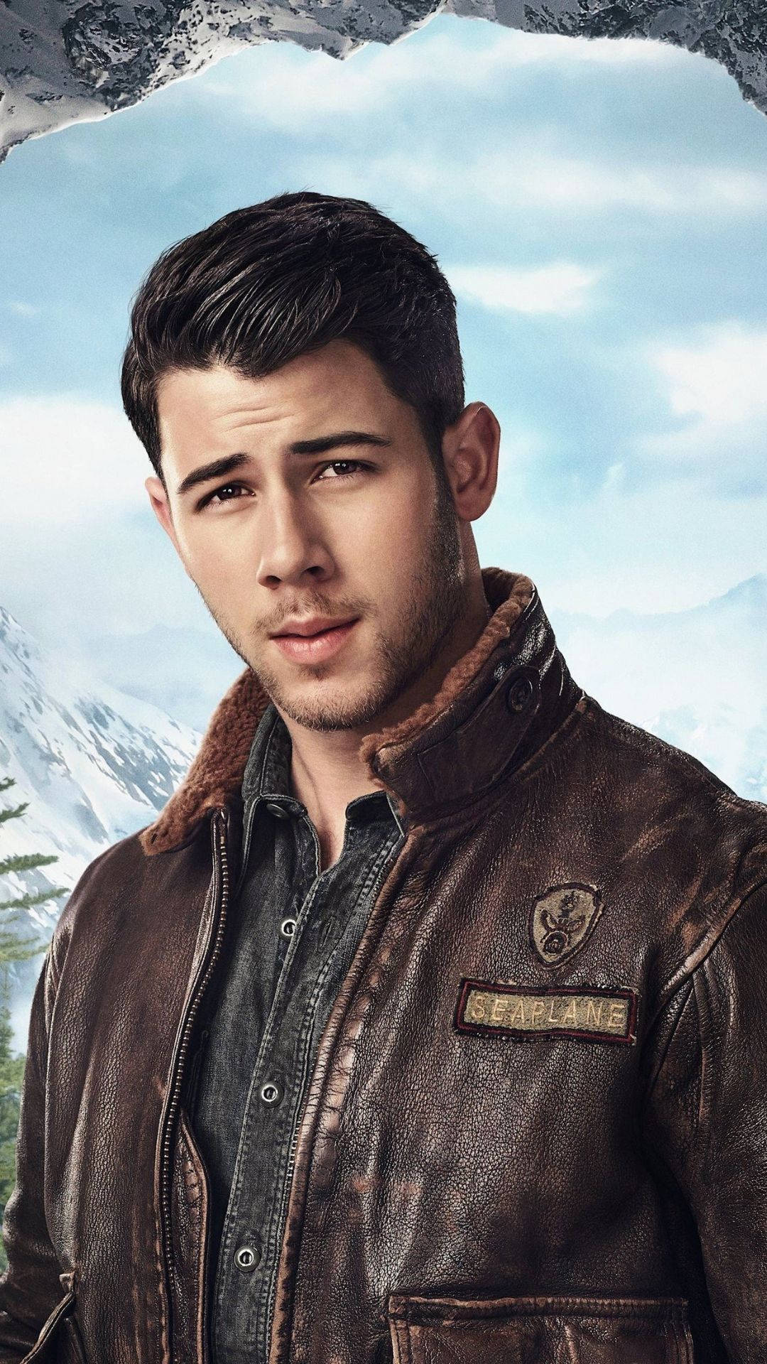 Nick Jonas, brown leather seaplane jacket, snowy mountain backdrop, Full HD Phone Wallpaper