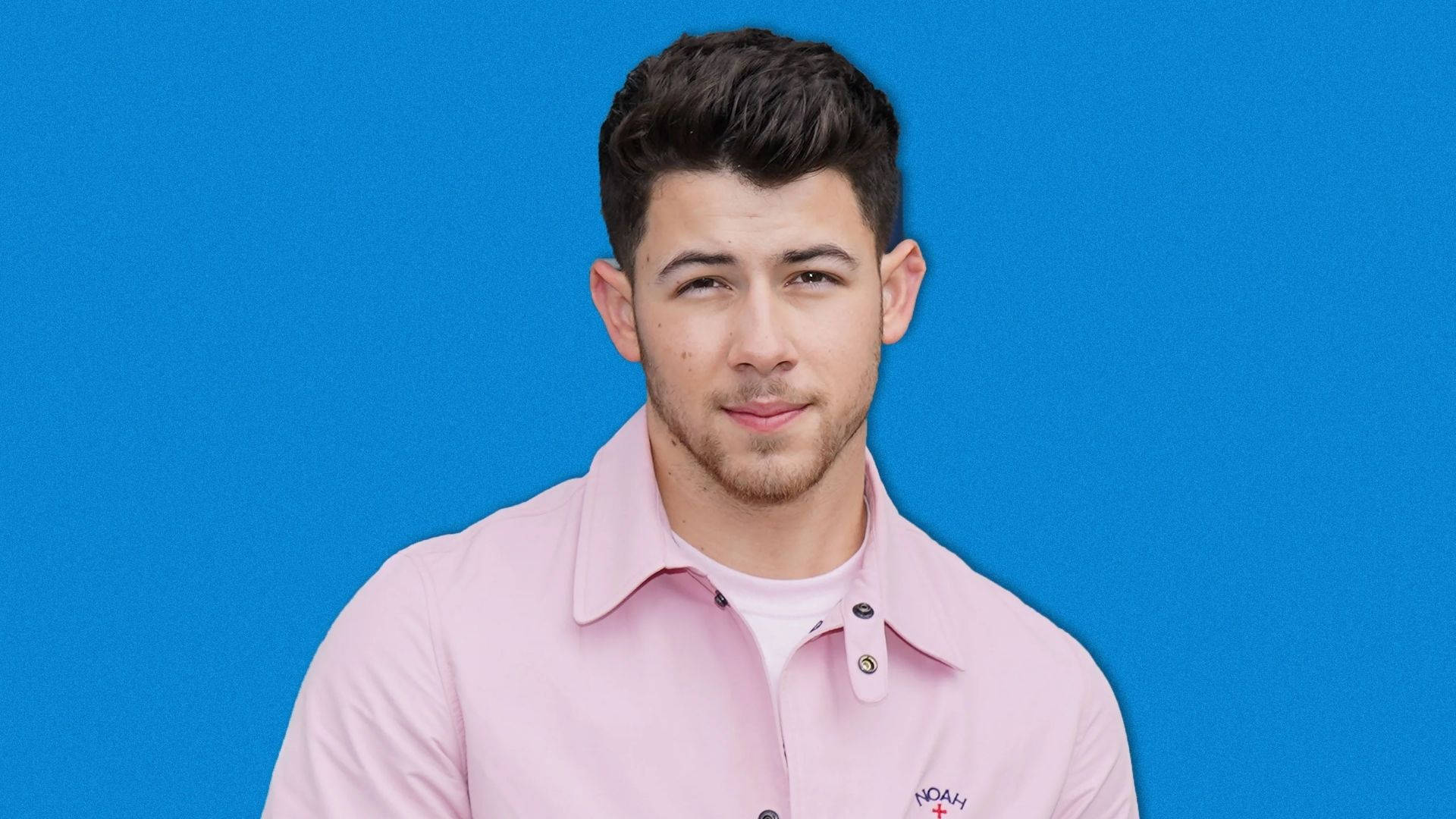 Nick Jonas, pink button-up shirt, solid blue background, Full HD Desktop Wallpaper