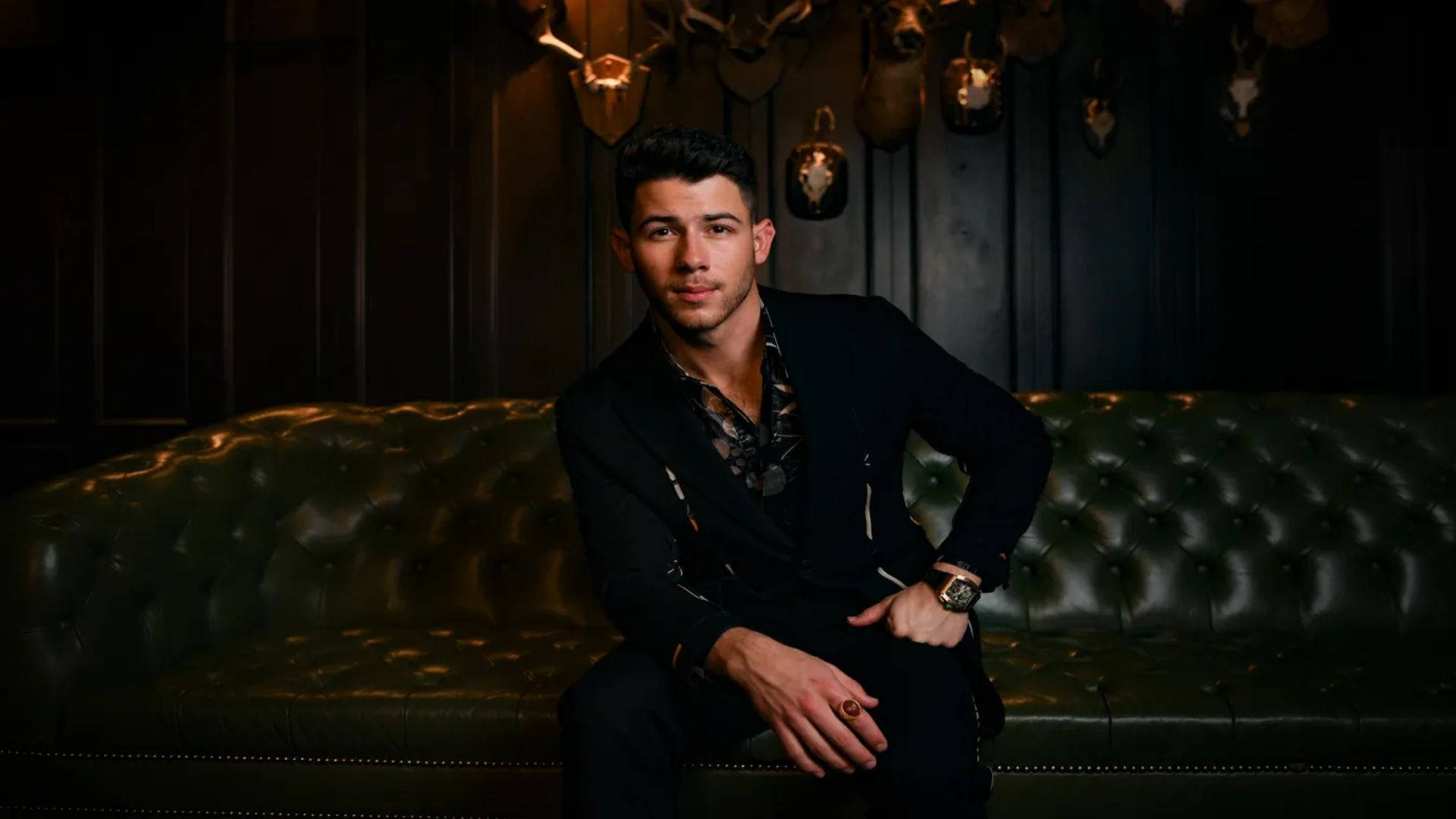 Nick Jonas, black suit, green tufted leather couch, Full HD Desktop Wallpaper