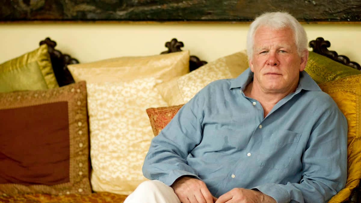 Nick Nolte, ornate couch, patterned cushions, SD Desktop Wallpaper