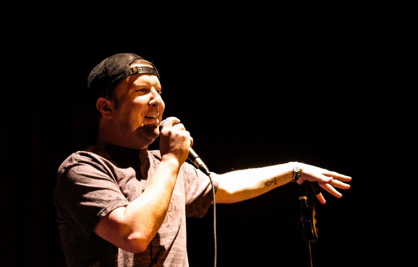 Nick Swardson, black background, dramatic spotlight, HD Desktop Wallpaper