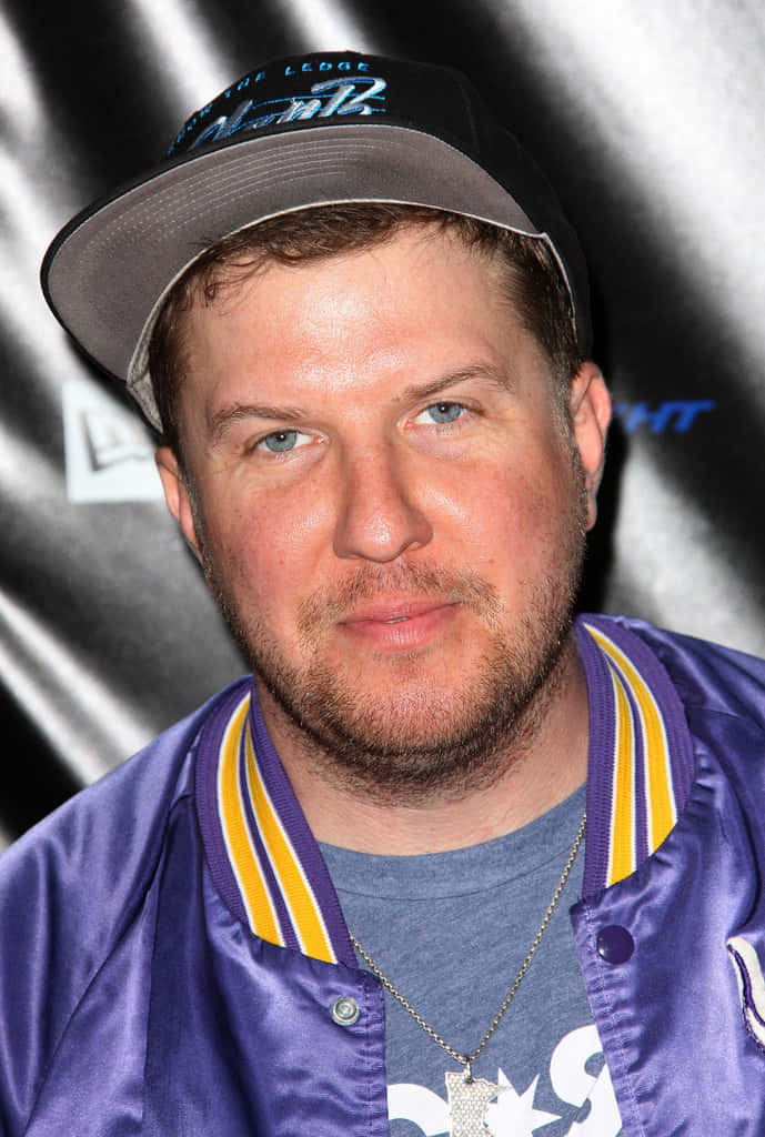 Nick Swardson, purple satin jacket, grey cap, SD Phone Wallpaper