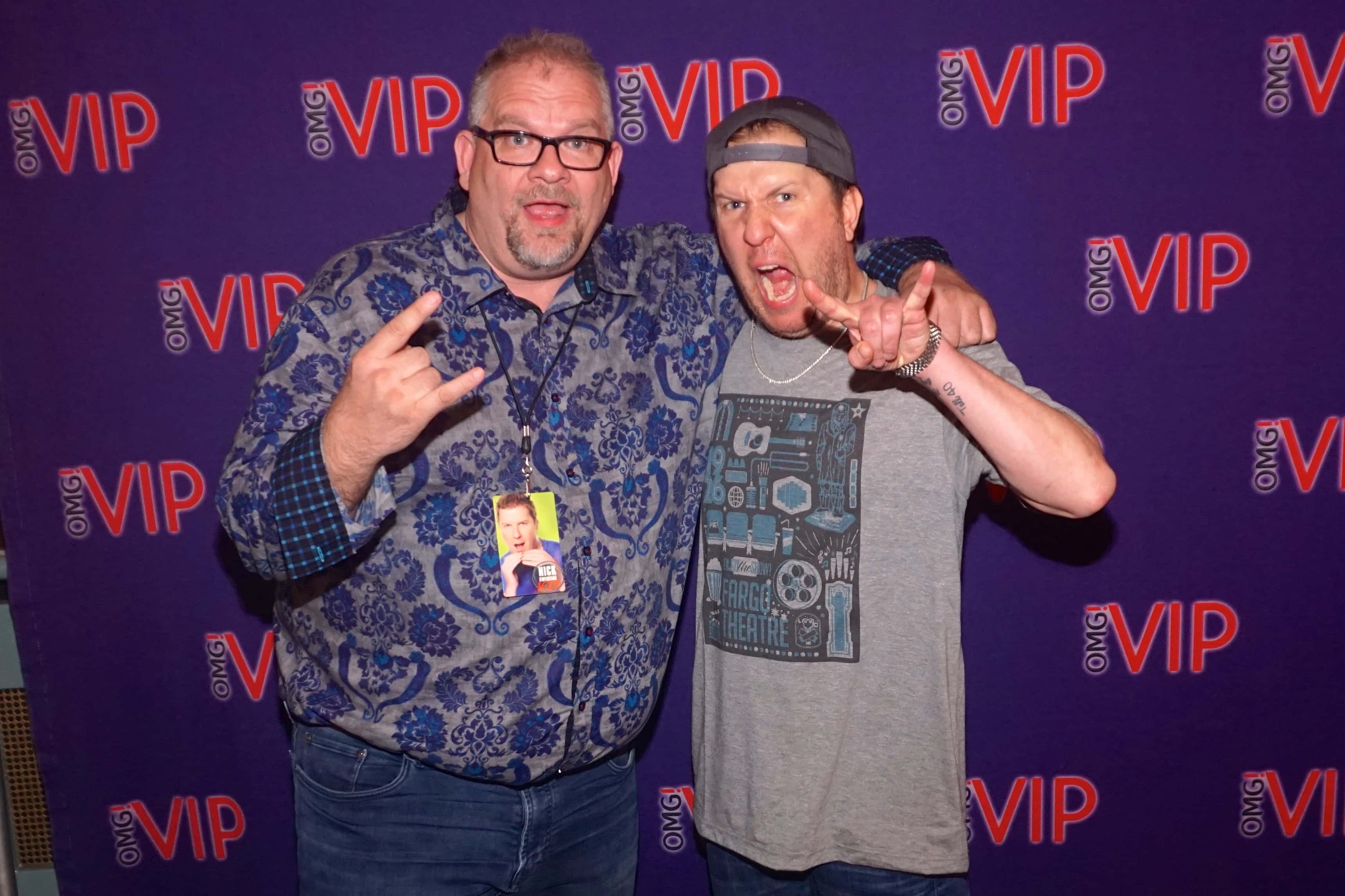 Nick Swardson, purple VIP backdrop, repeating red logos, 2K Desktop Wallpaper