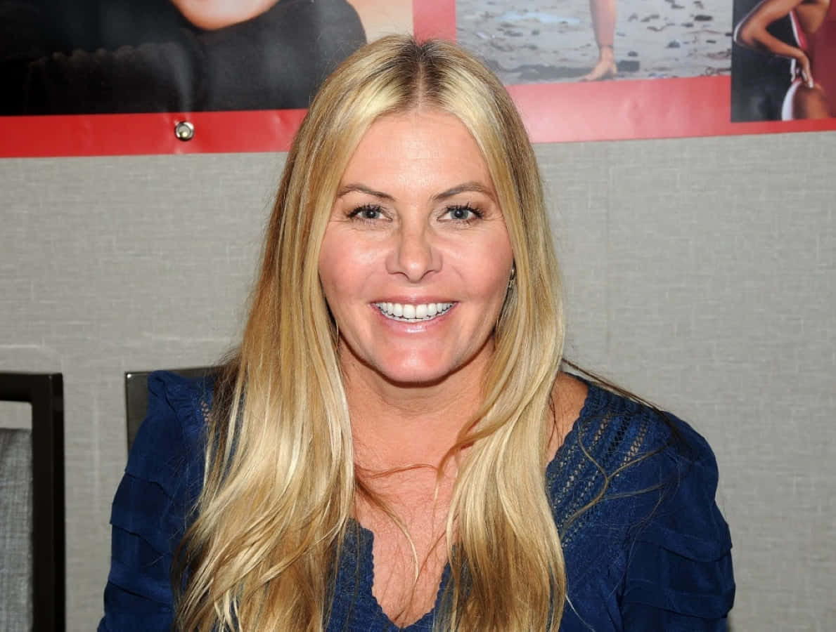 Nicole Eggert, blue top, gray wall, SD Desktop Wallpaper