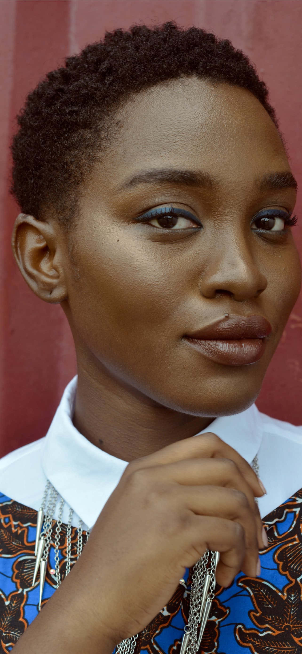 Nigerian Woman, short curly hair, bold blue eyeshadow, 2K Phone Wallpaper