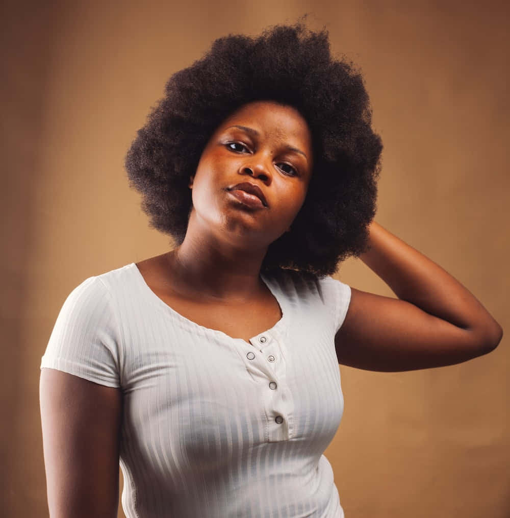 Nigerian Woman, old brown backdrop, voluminous afro hair, SD Phone Wallpaper
