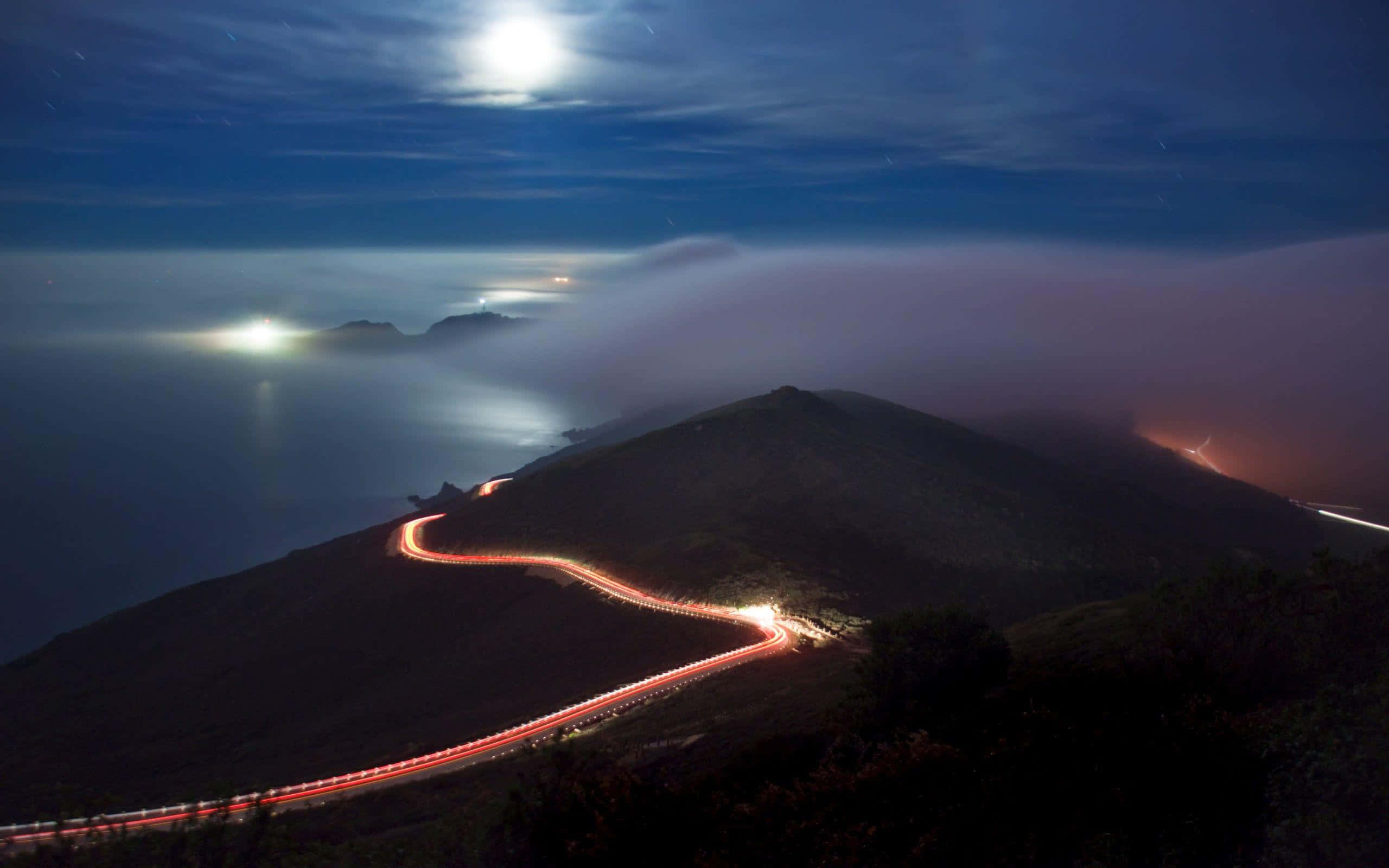 coastal road, red taillights, bright moonlit sky, 2K Desktop Wallpaper