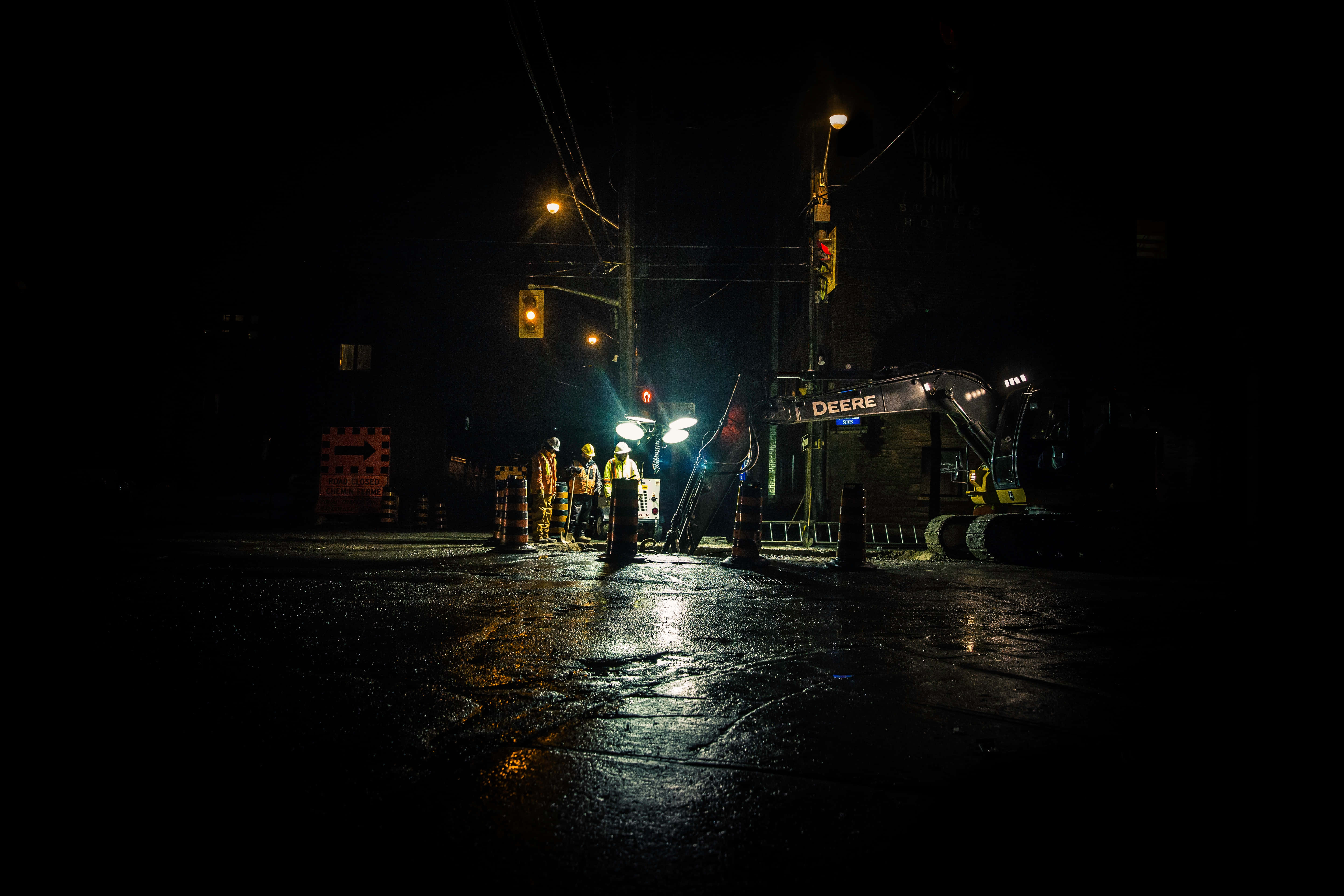 Deere excavator, streetlights, wet asphalt road, 5K Desktop Wallpaper