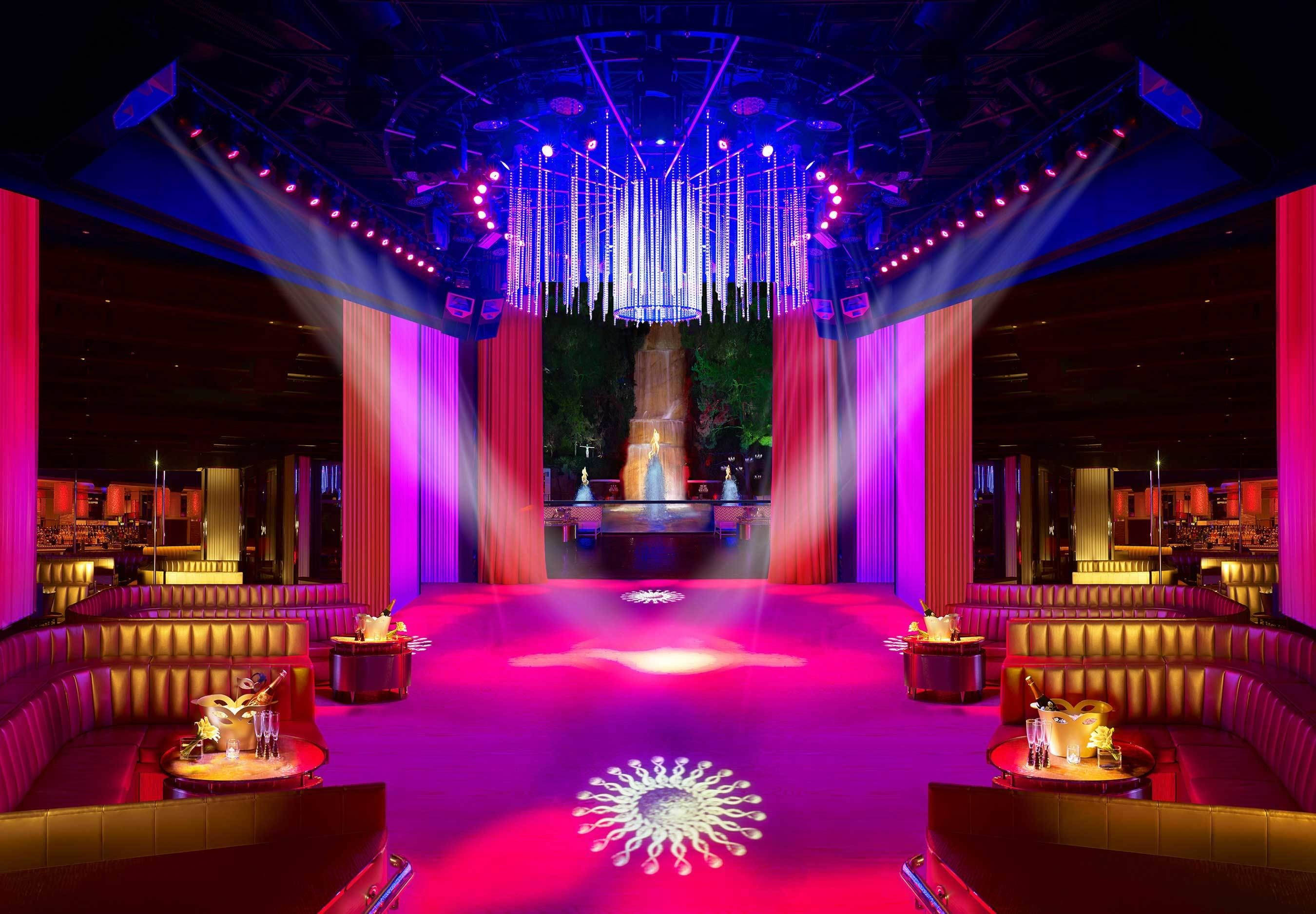 modern night bar, vibrant pink and purple lights, glowing chandelier, 2K Desktop Wallpaper